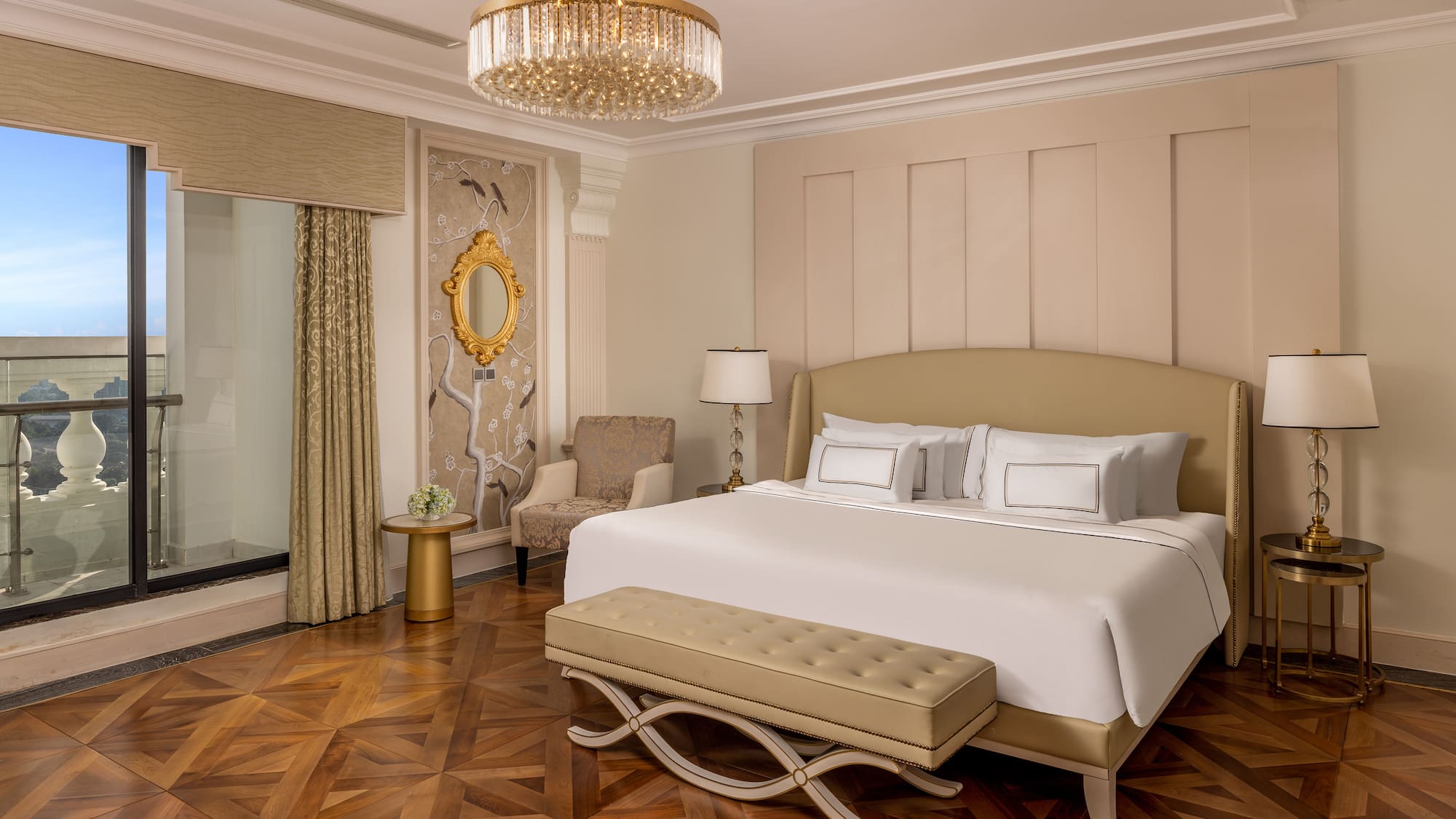 a bedroom with a bed and a chandelier