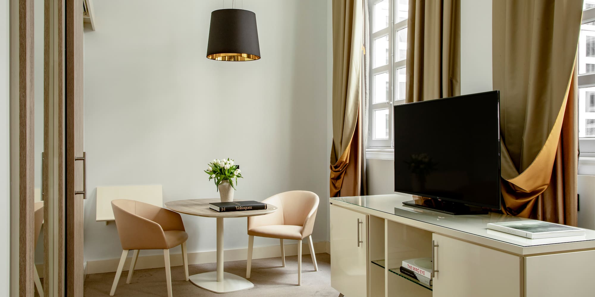 a room with a tv and a table