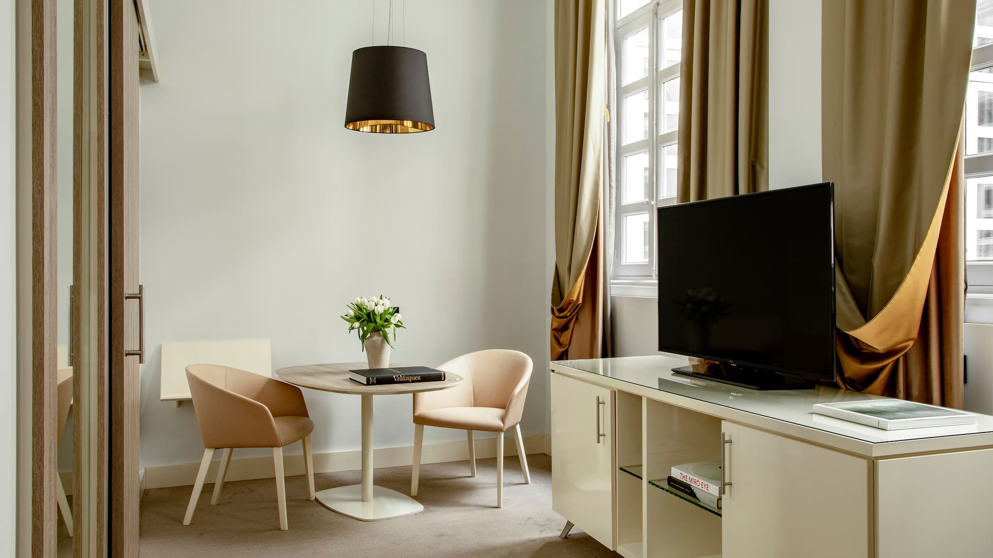 a room with a tv and a table