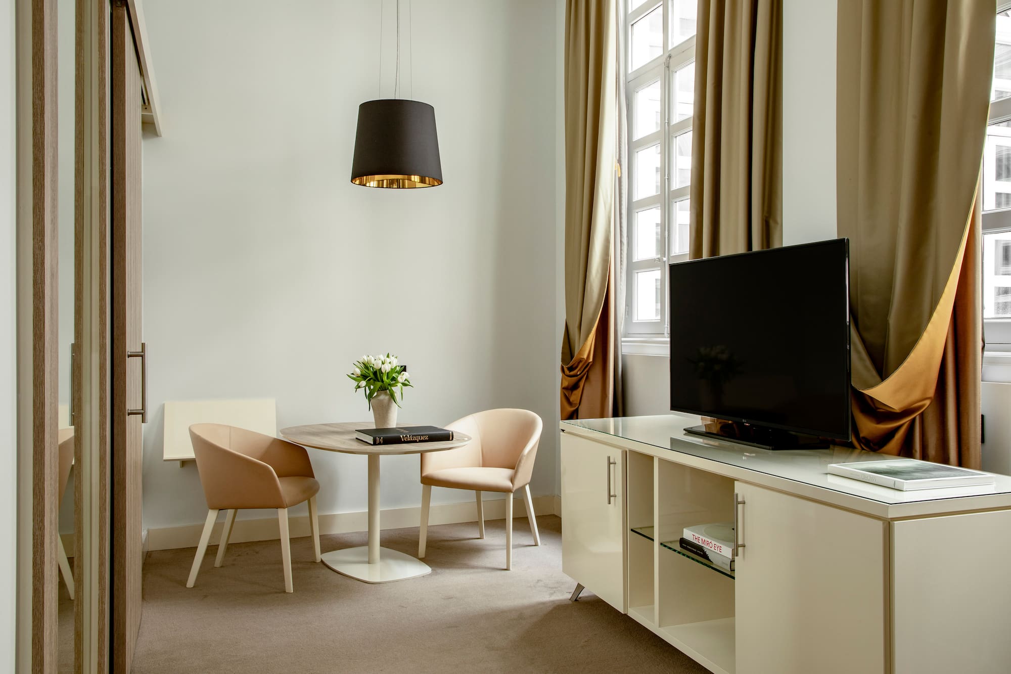 a room with a tv and a table