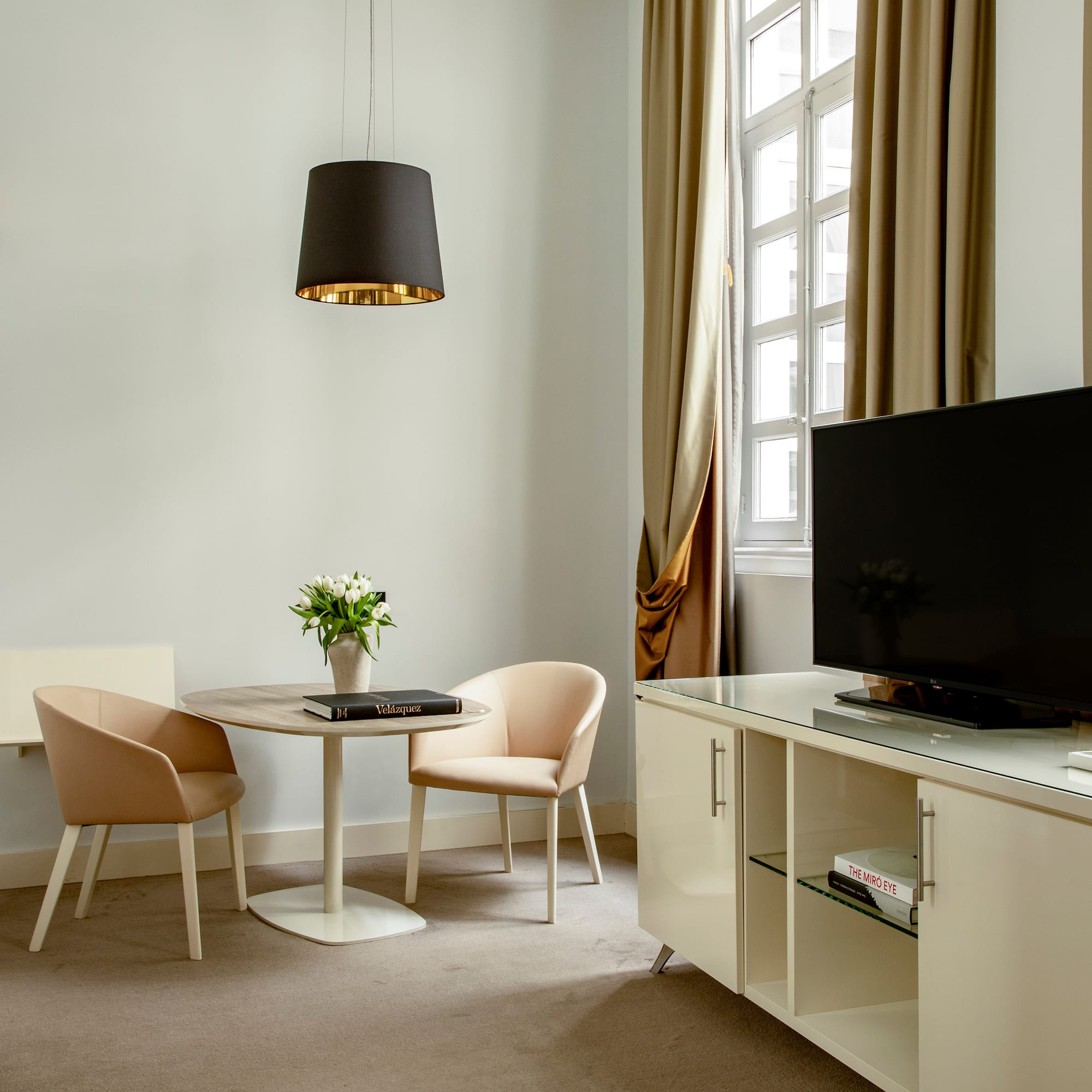 a room with a tv and a table