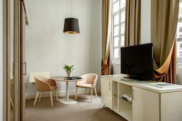 a room with a tv and a table