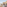 Luxury hotel rooftop terrace with lounge chairs, outdoor dining, and city view.
