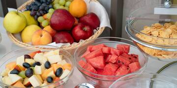 a group of bowls of fruit