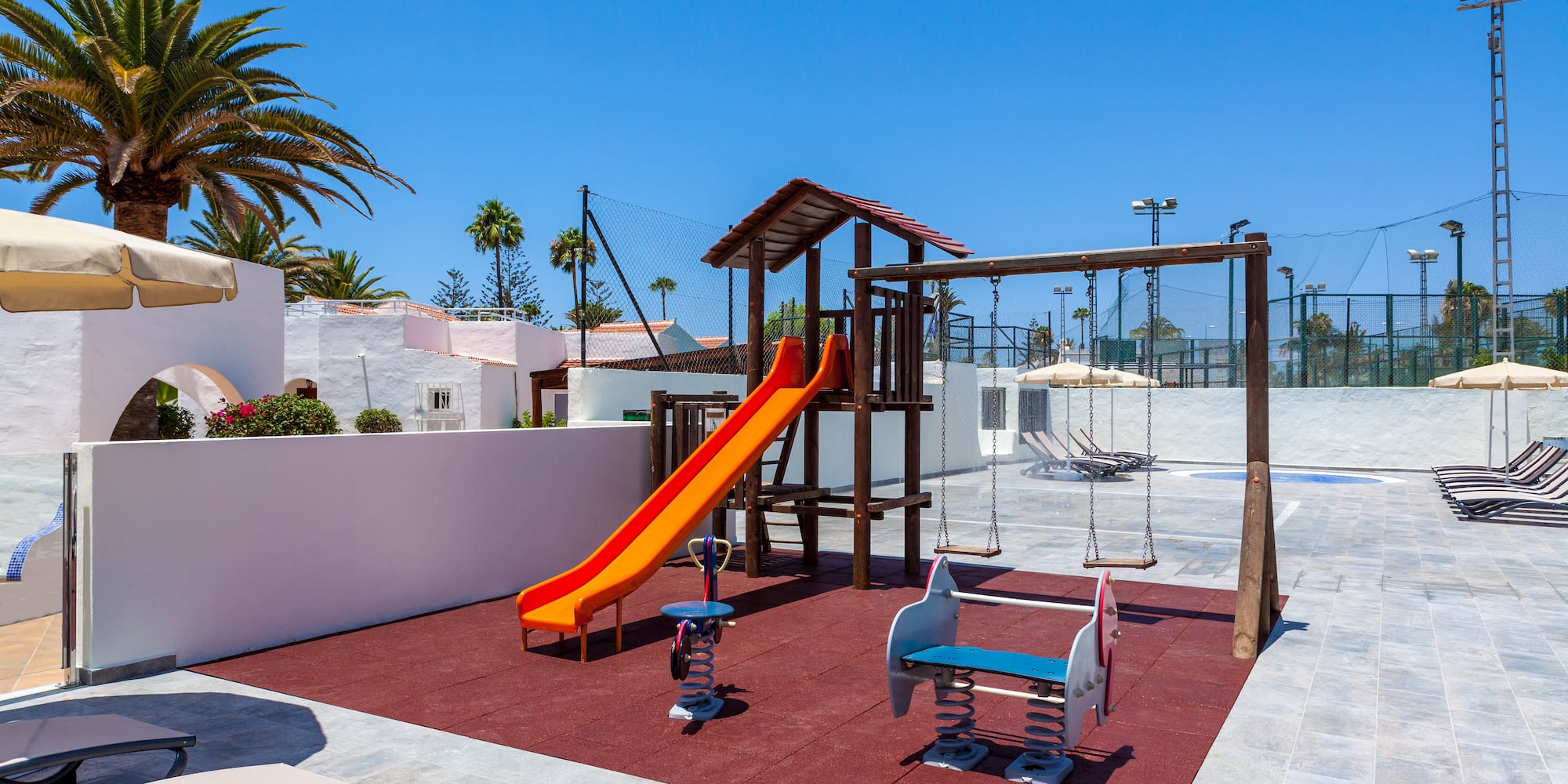 a playground with swings and a slide