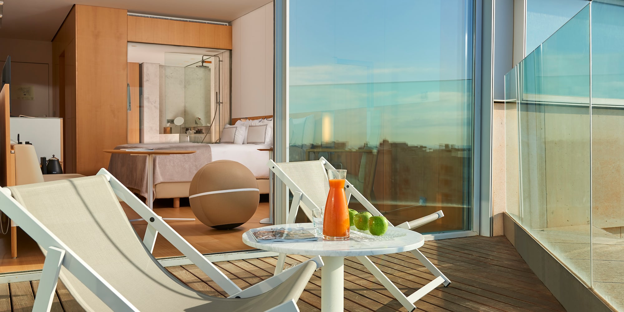 a deck with chairs and a table