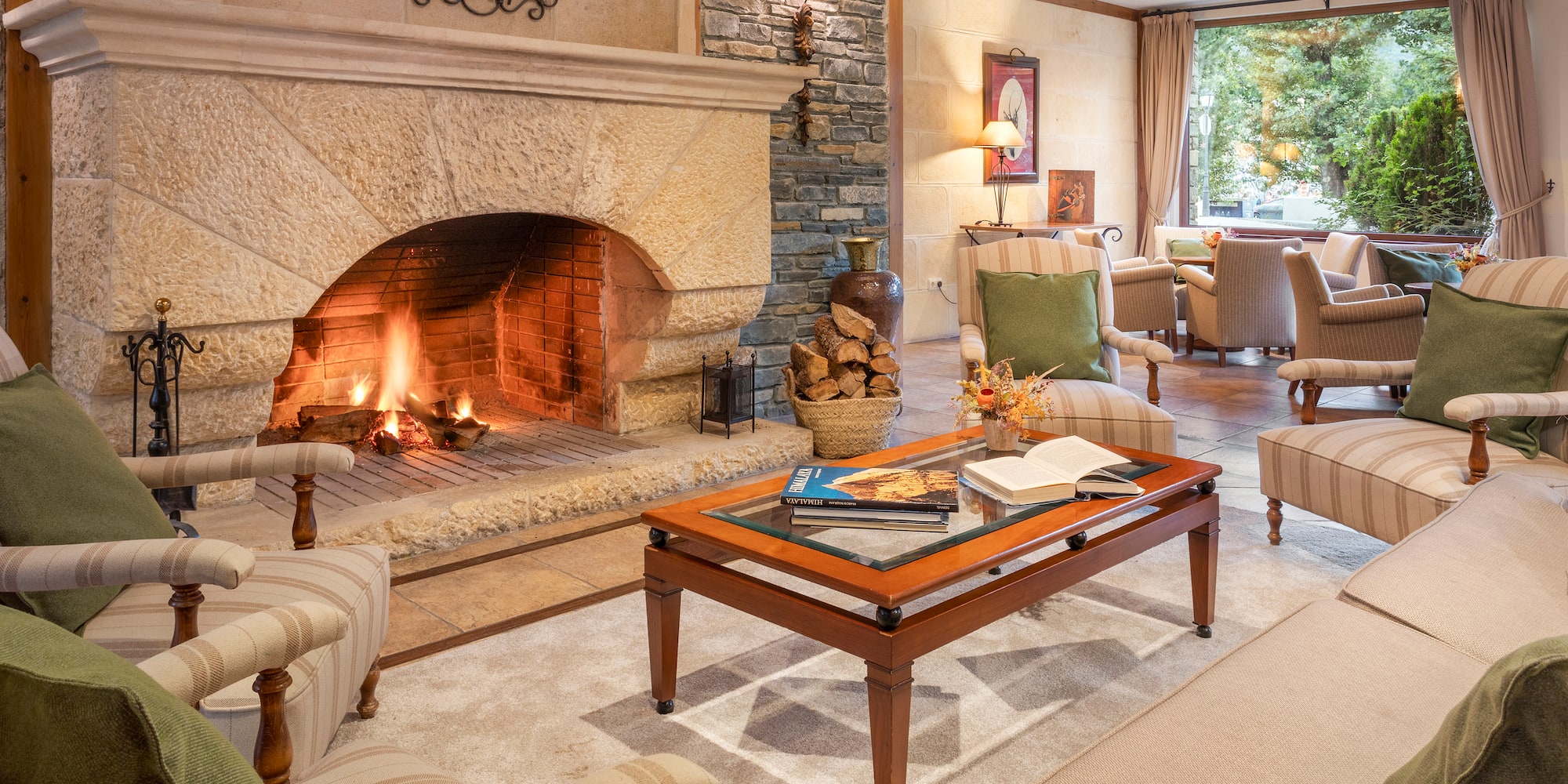 a living room with a fireplace and chairs