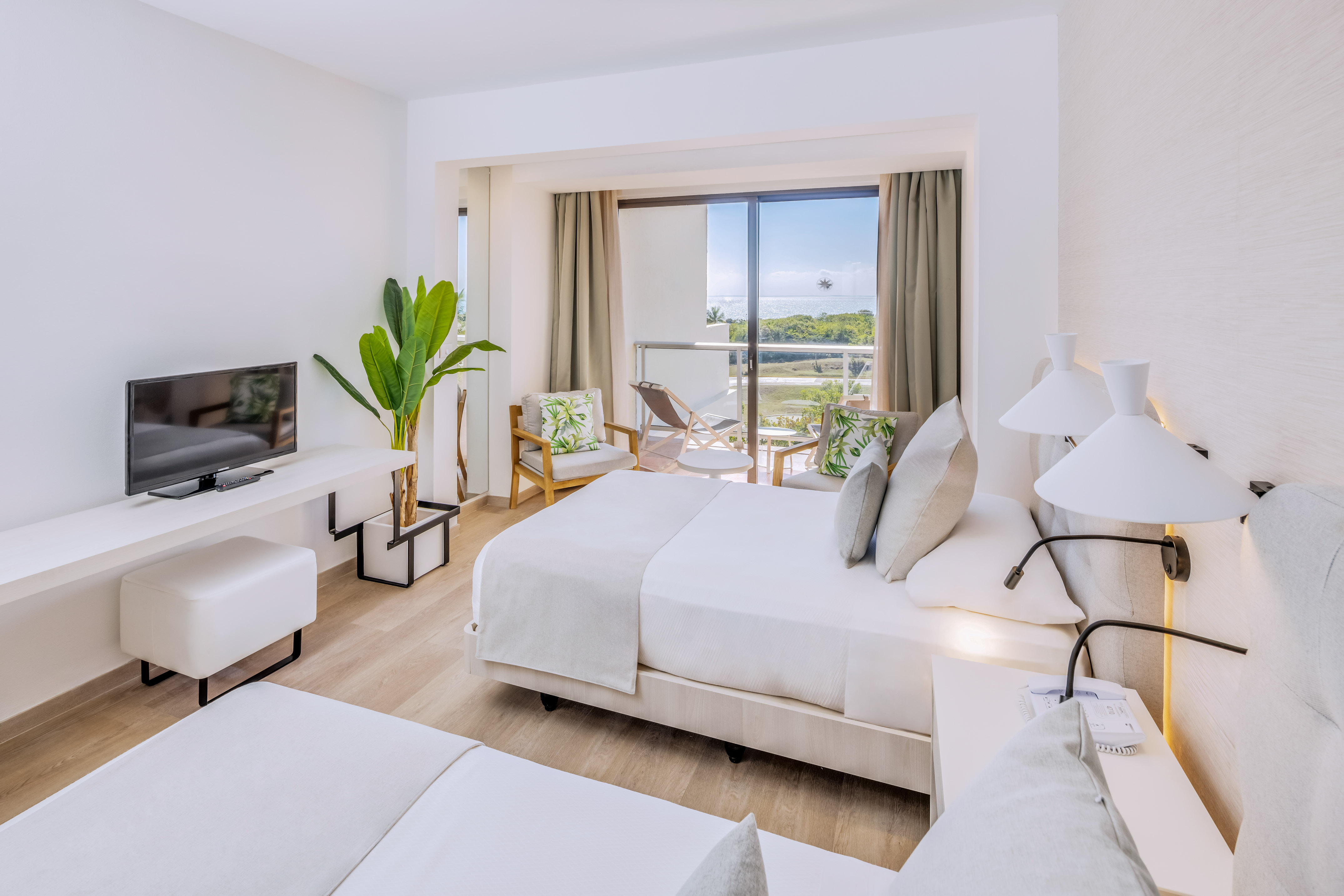 a room with a television and a bed