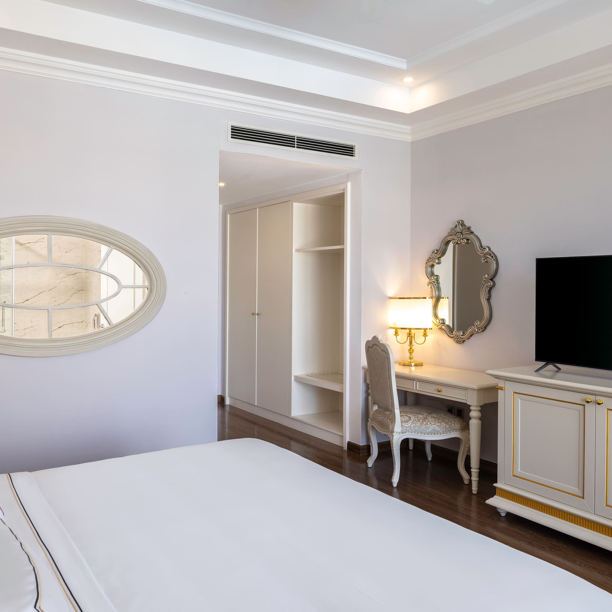 a room with a bed and a mirror