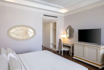 a room with a bed and a mirror