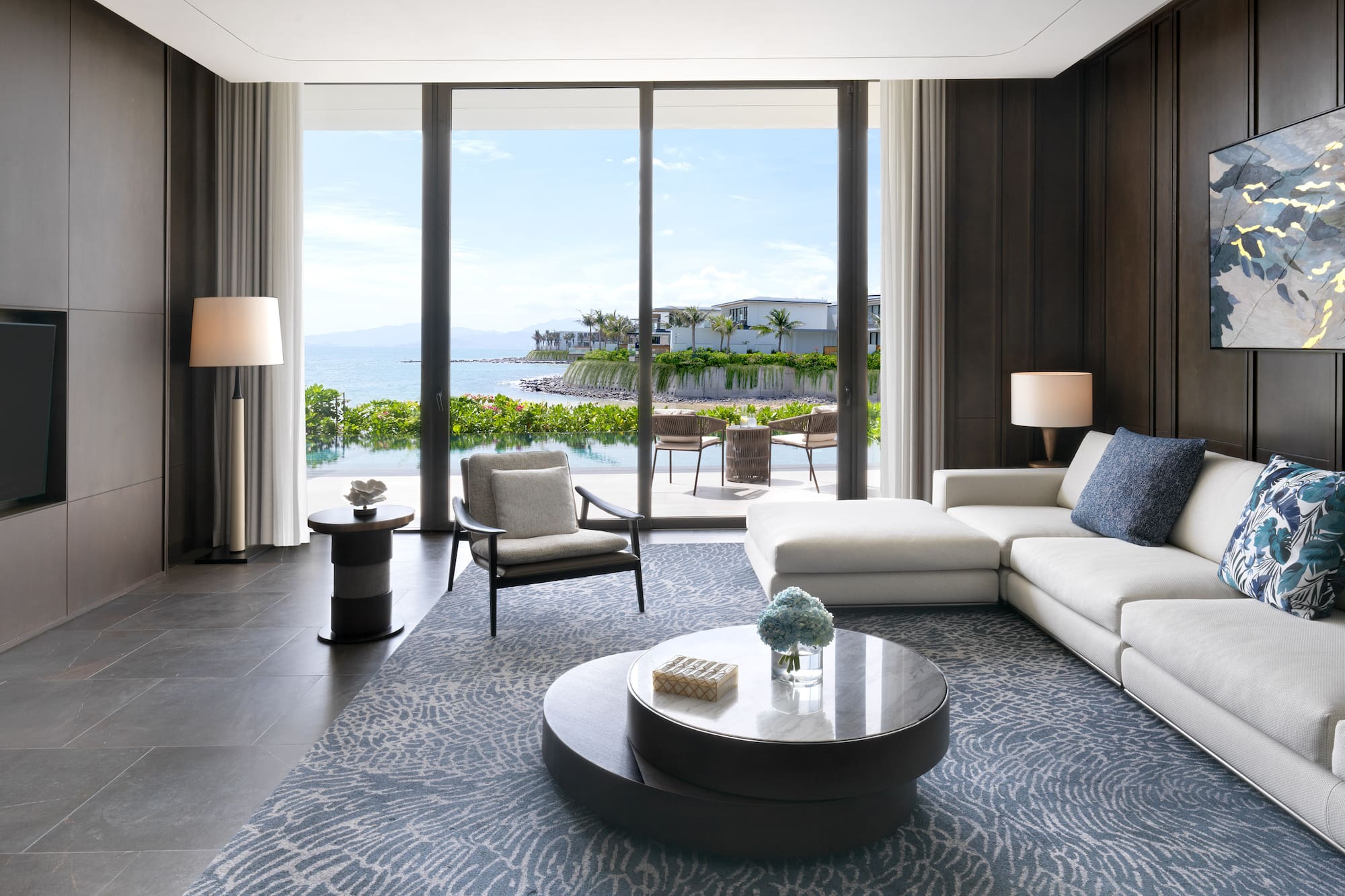 a living room with a large glass door