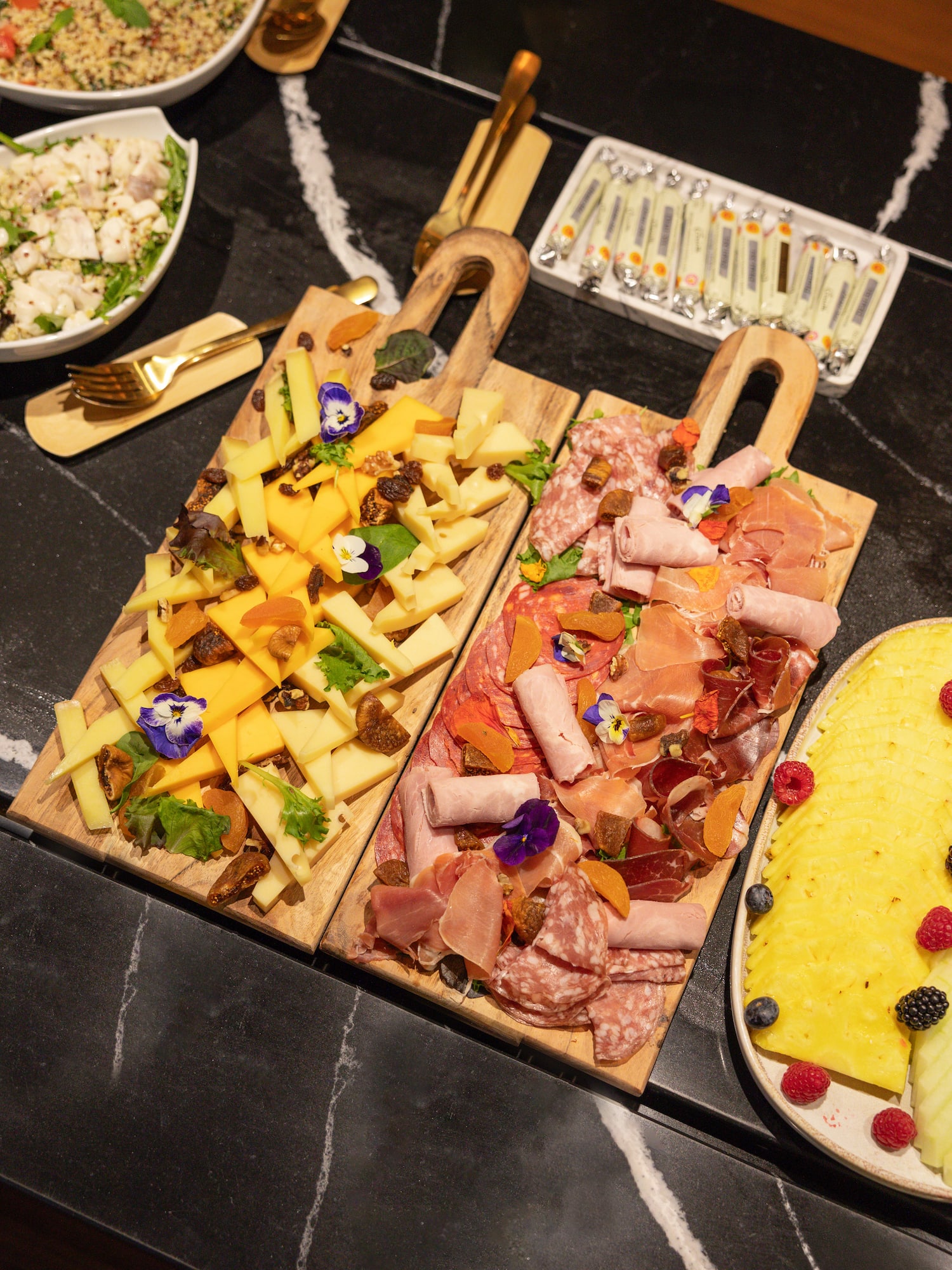 a group of cutting boards with different types of food on them