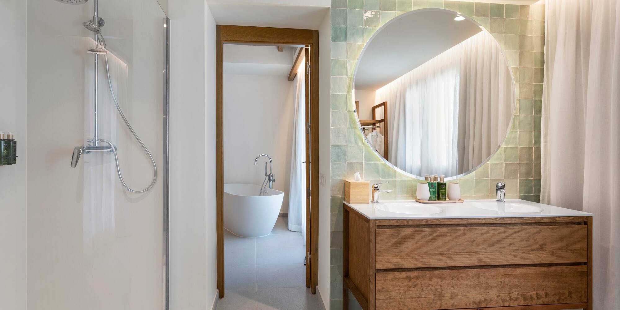 a bathroom with a large round mirror
