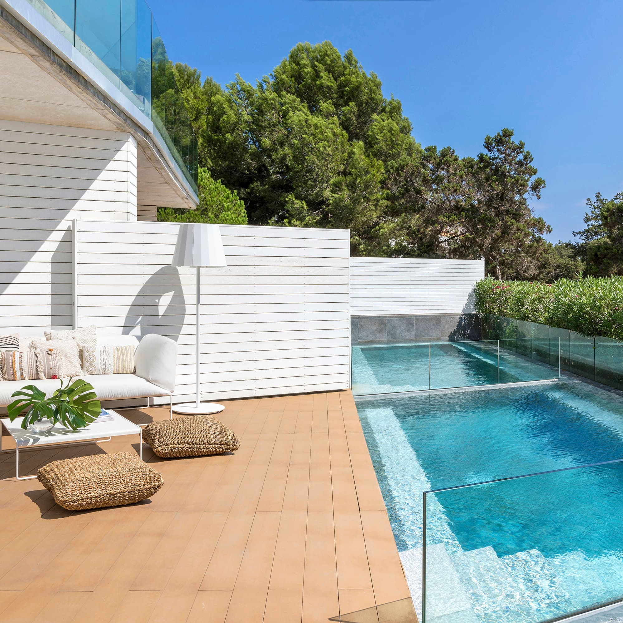 a swimming pool and a white building