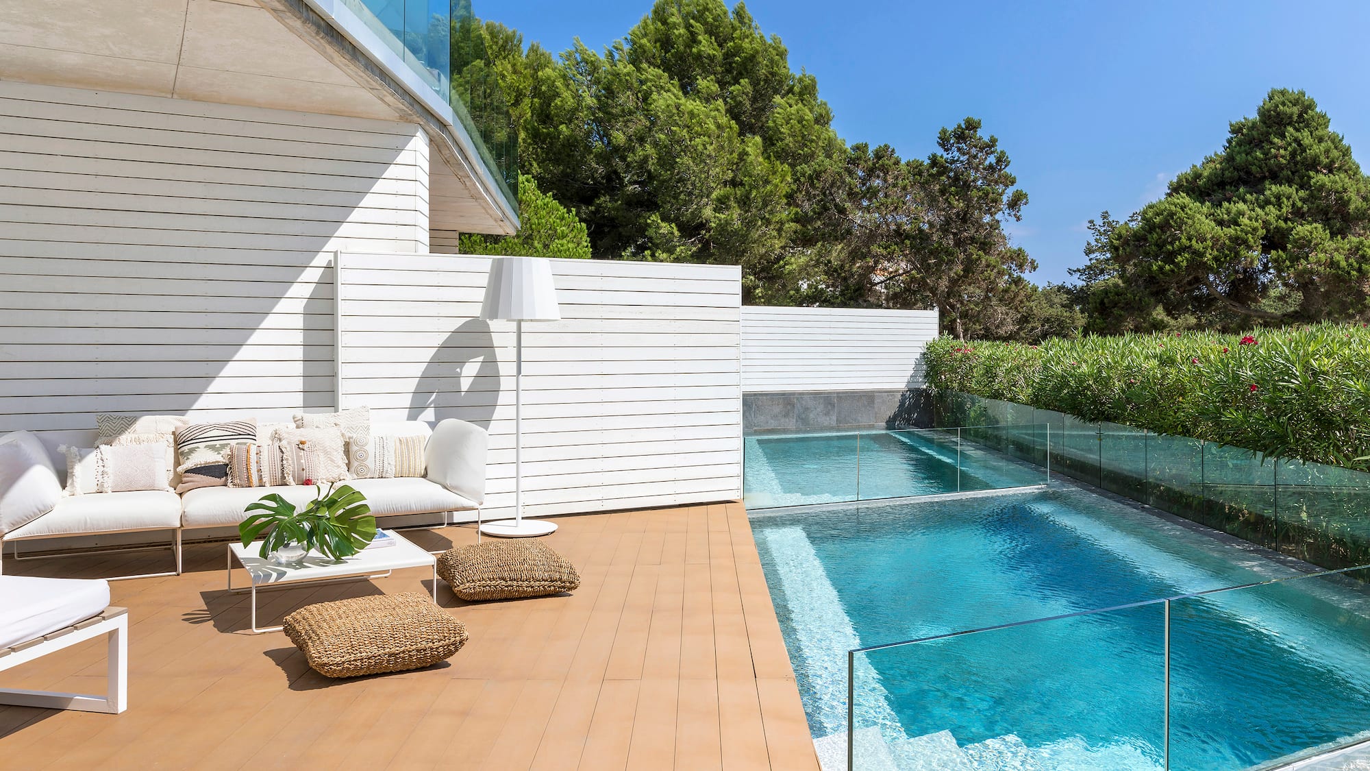 a swimming pool and a white building