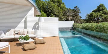 a swimming pool and a white building