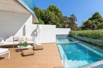 a swimming pool and a white building