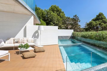 a swimming pool and a white building