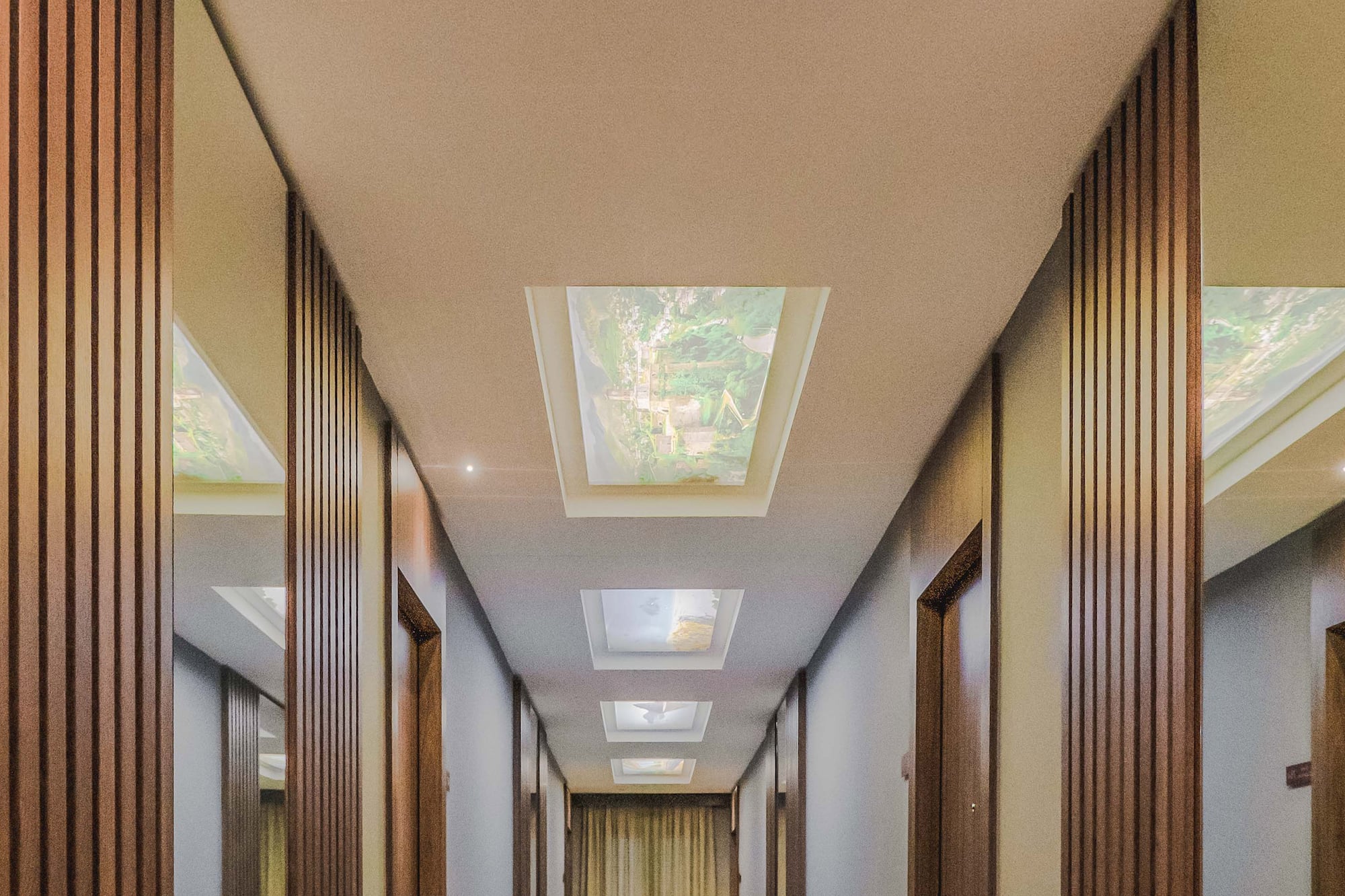 a hallway with a ceiling and a light fixture