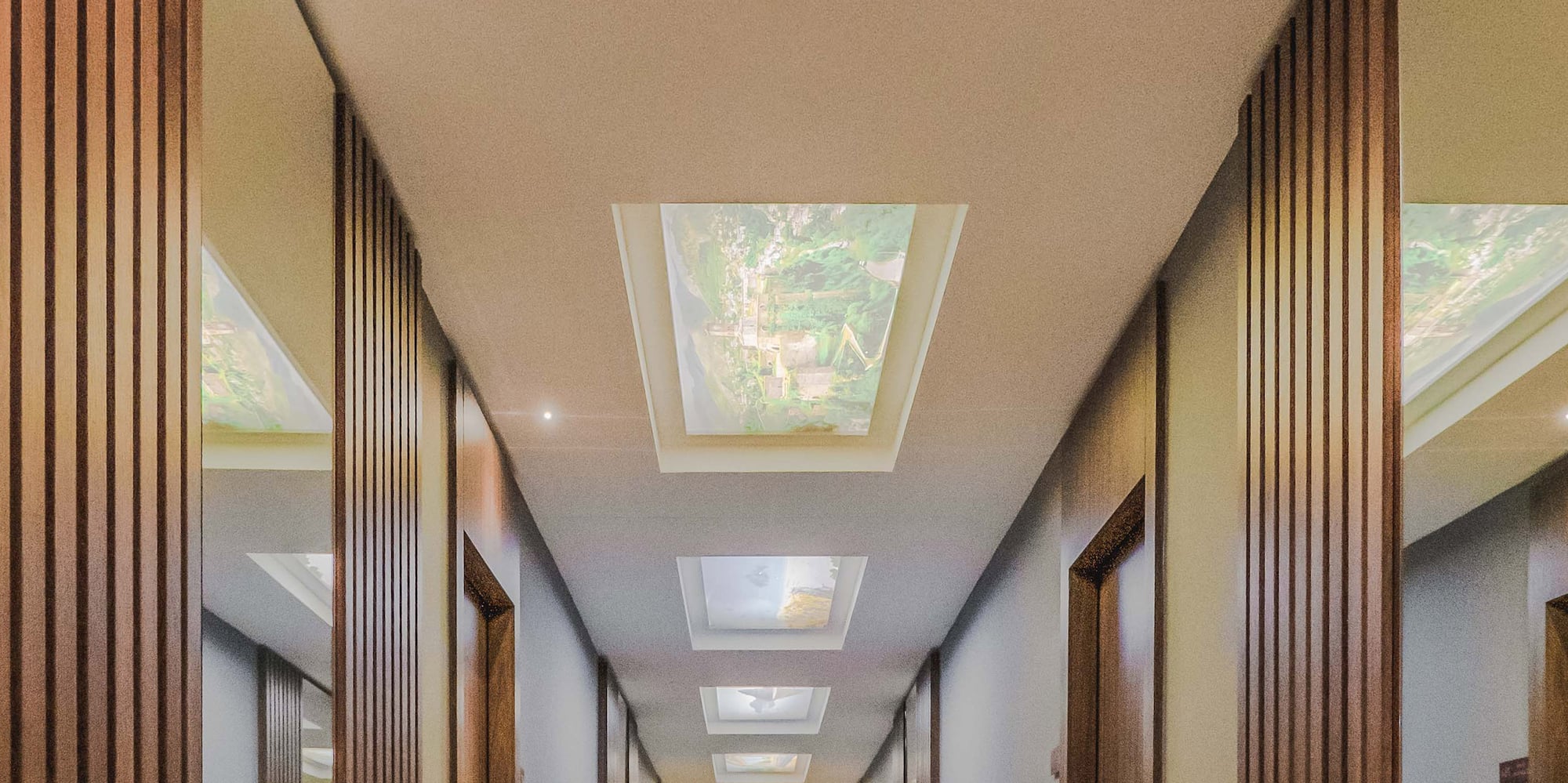 a hallway with a ceiling and a light fixture