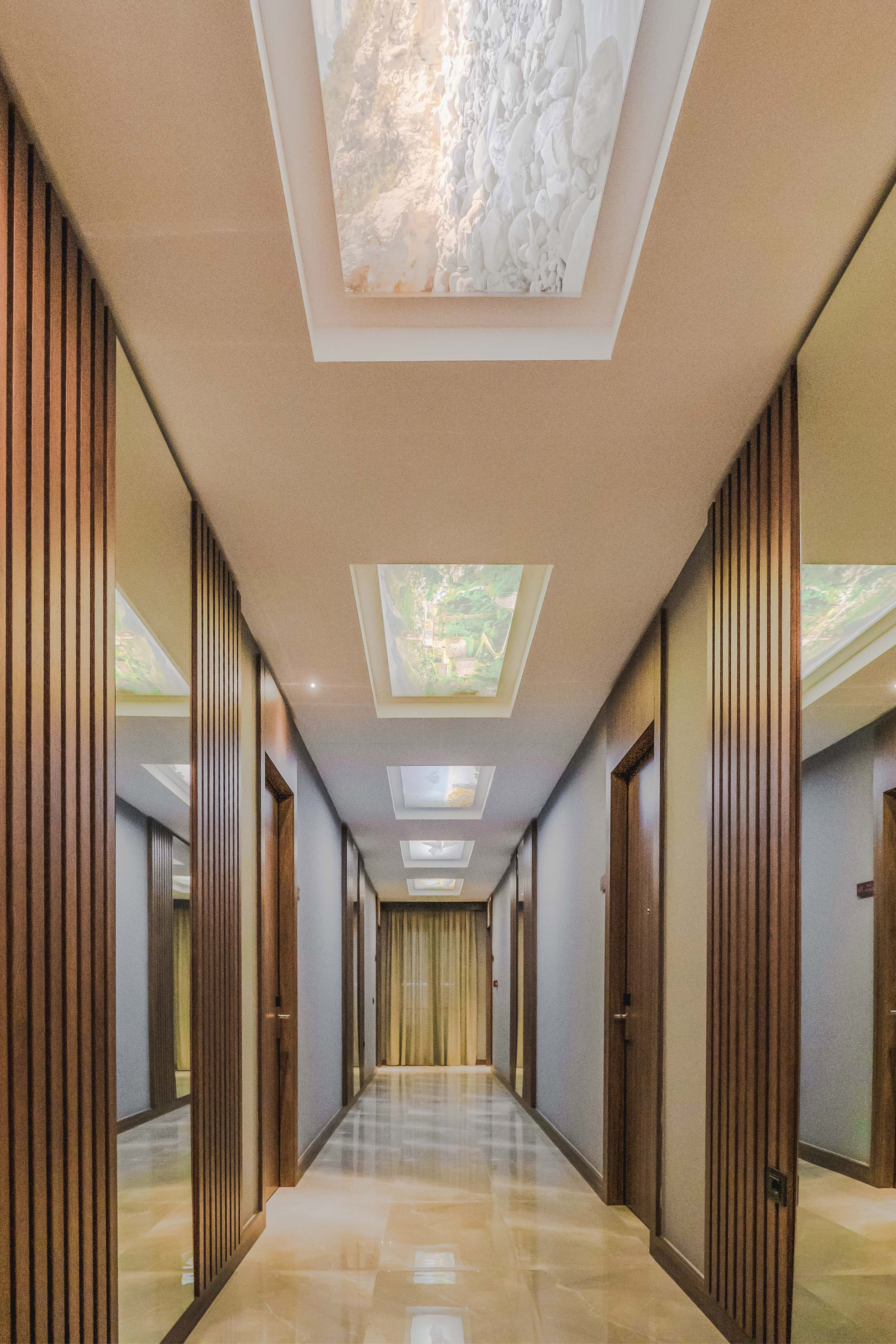 a hallway with a ceiling and a light fixture