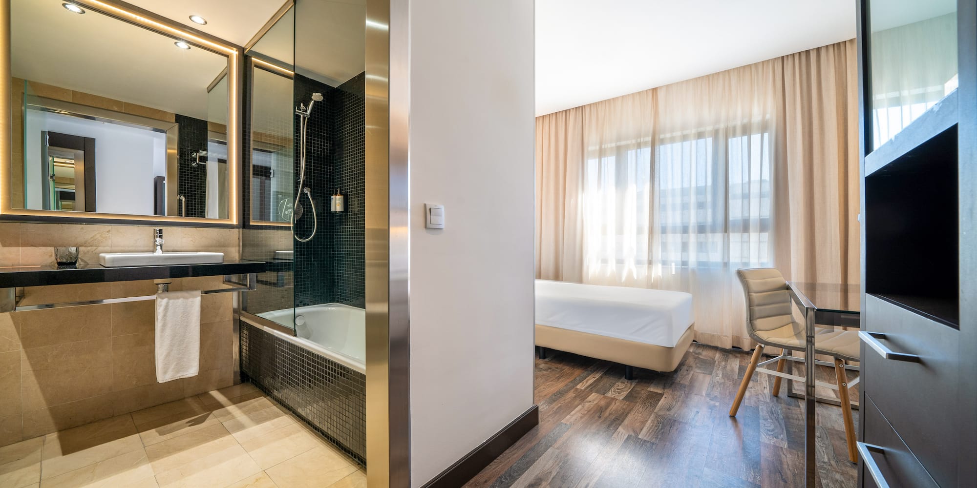 a room with a bed and a bathtub