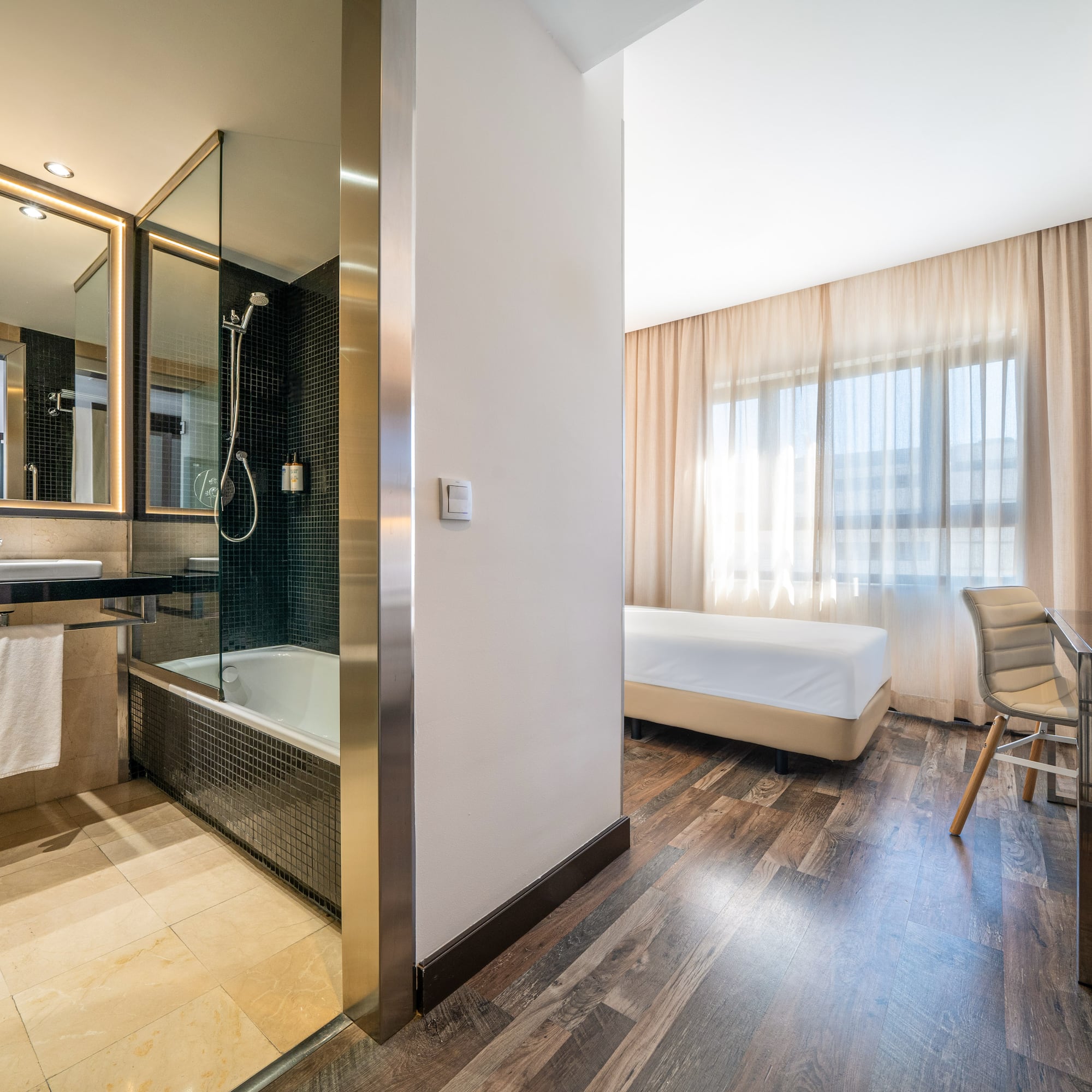 a room with a bed and a bathtub