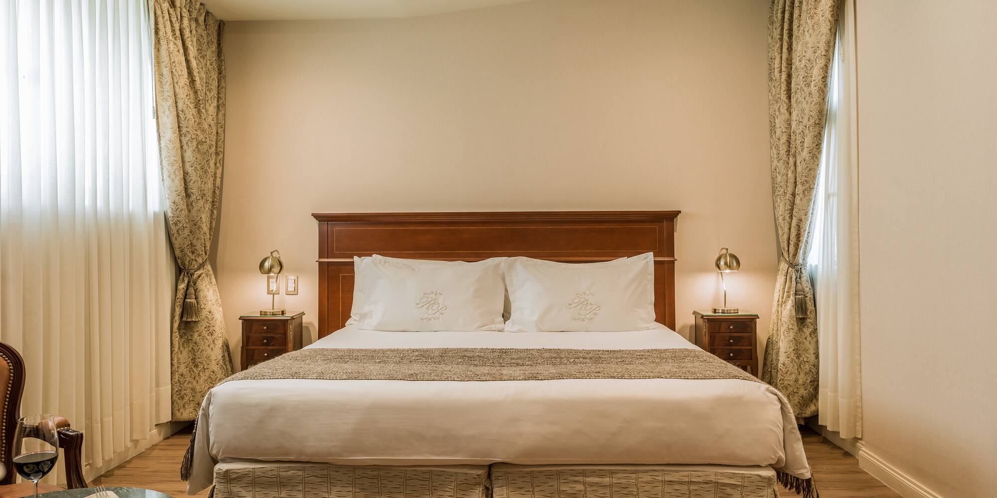 a bed with a wood headboard and a wood floor