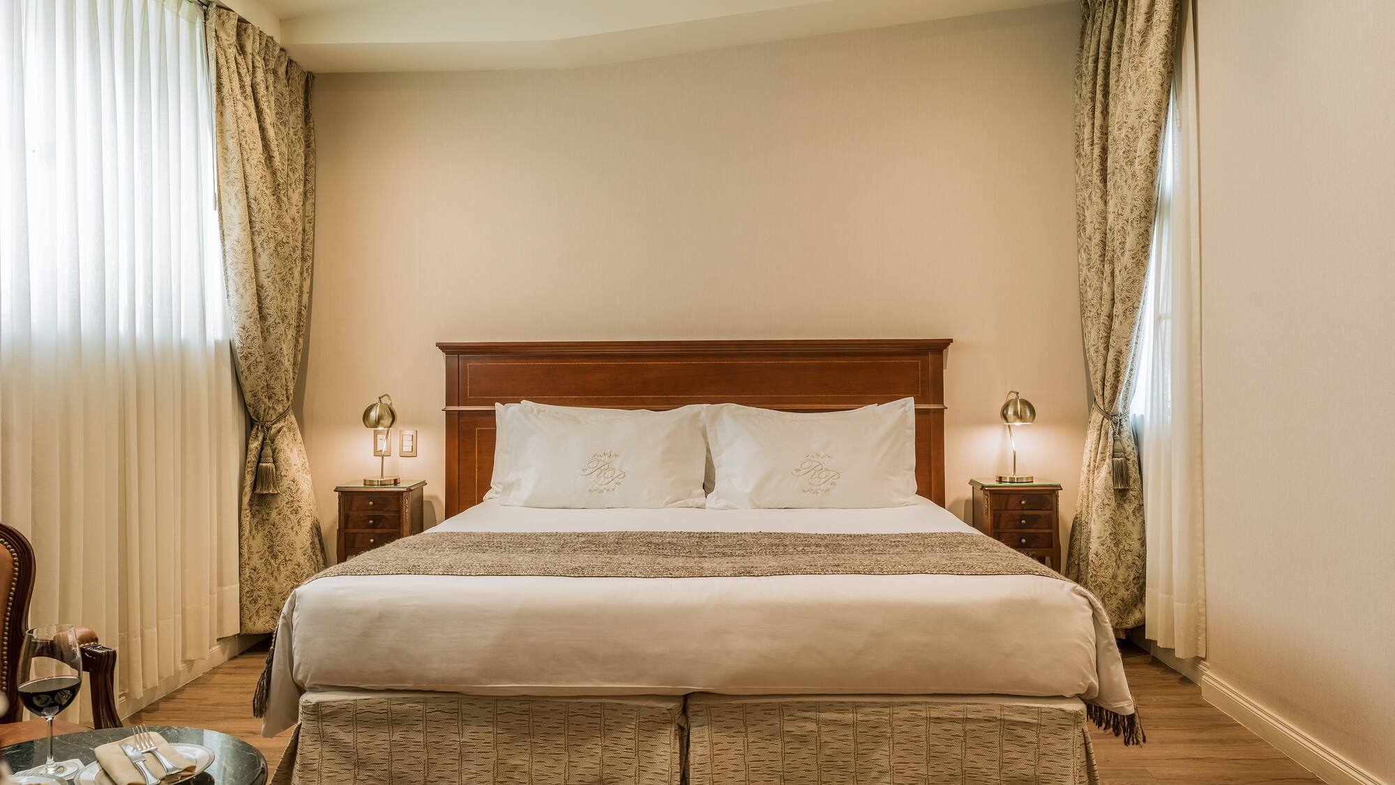 a bed with a wood headboard and a wood floor