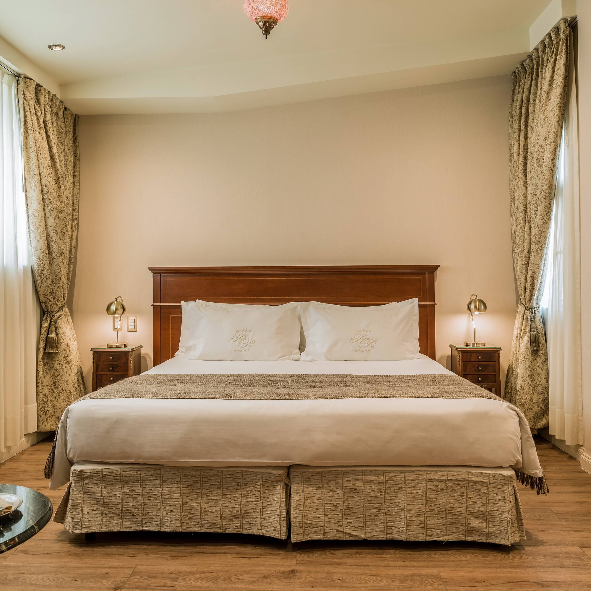 a bed with a wood headboard and a wood floor