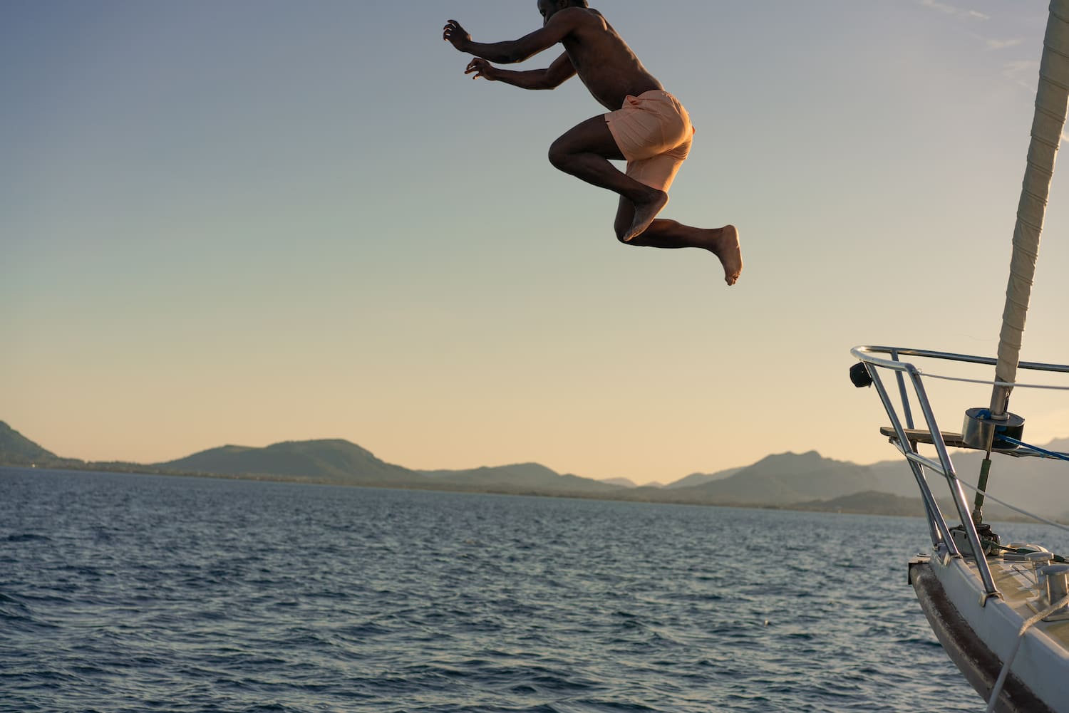 a man jumping into the water