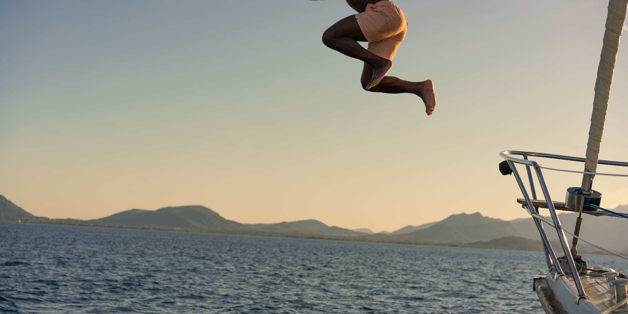 a man jumping into the water