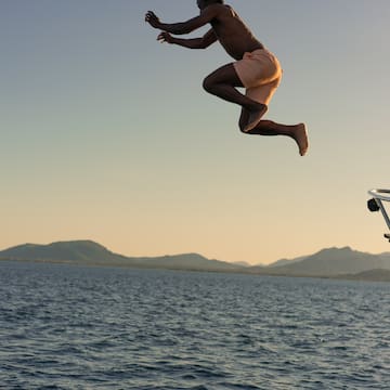 a man jumping into the water