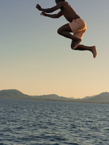a man jumping into the water