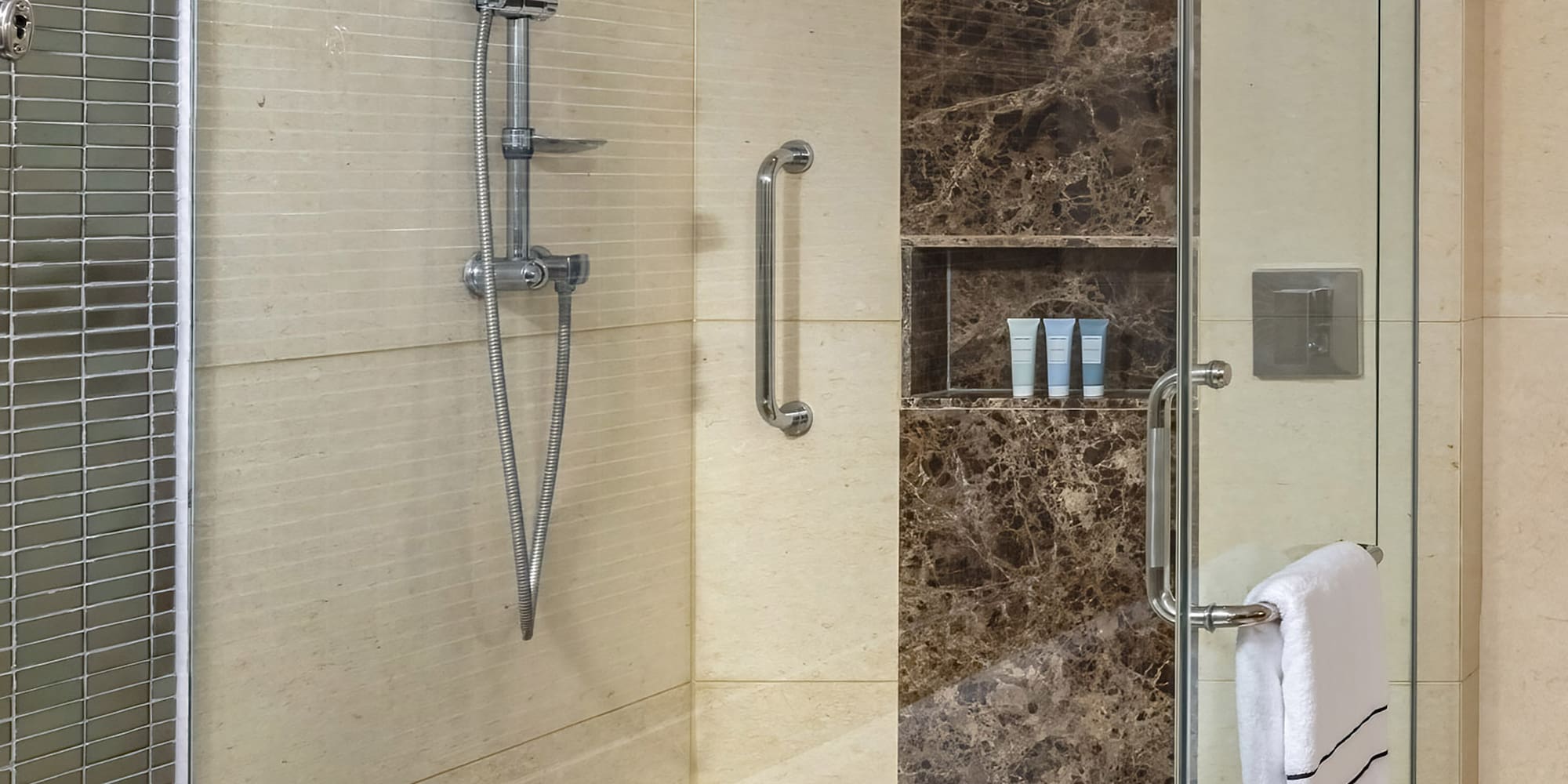 a bathroom with a bathtub and shower