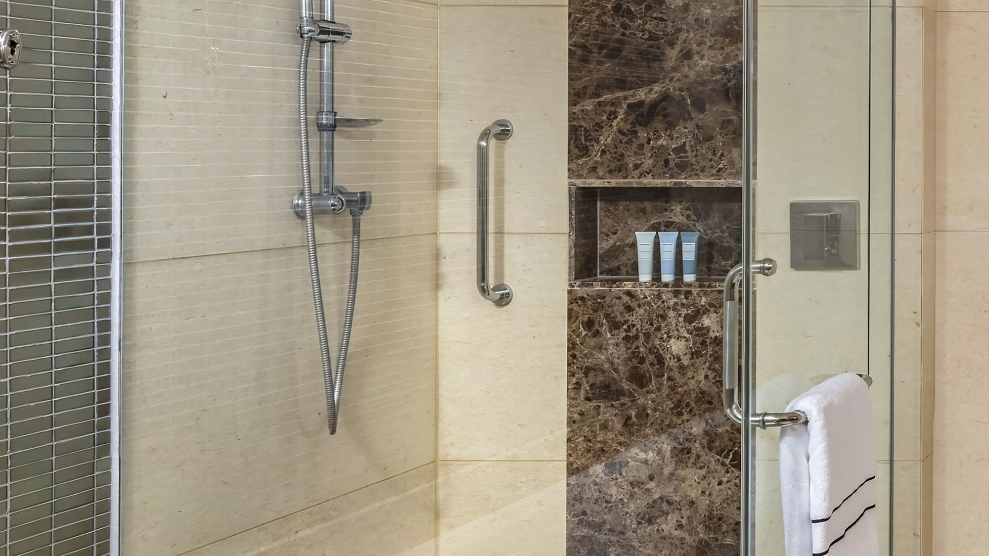 a bathroom with a bathtub and shower