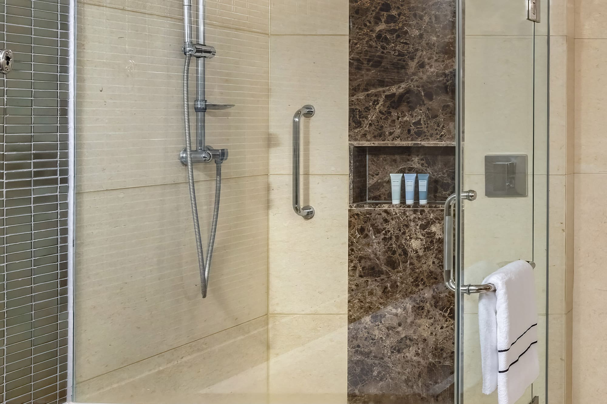 a bathroom with a bathtub and shower