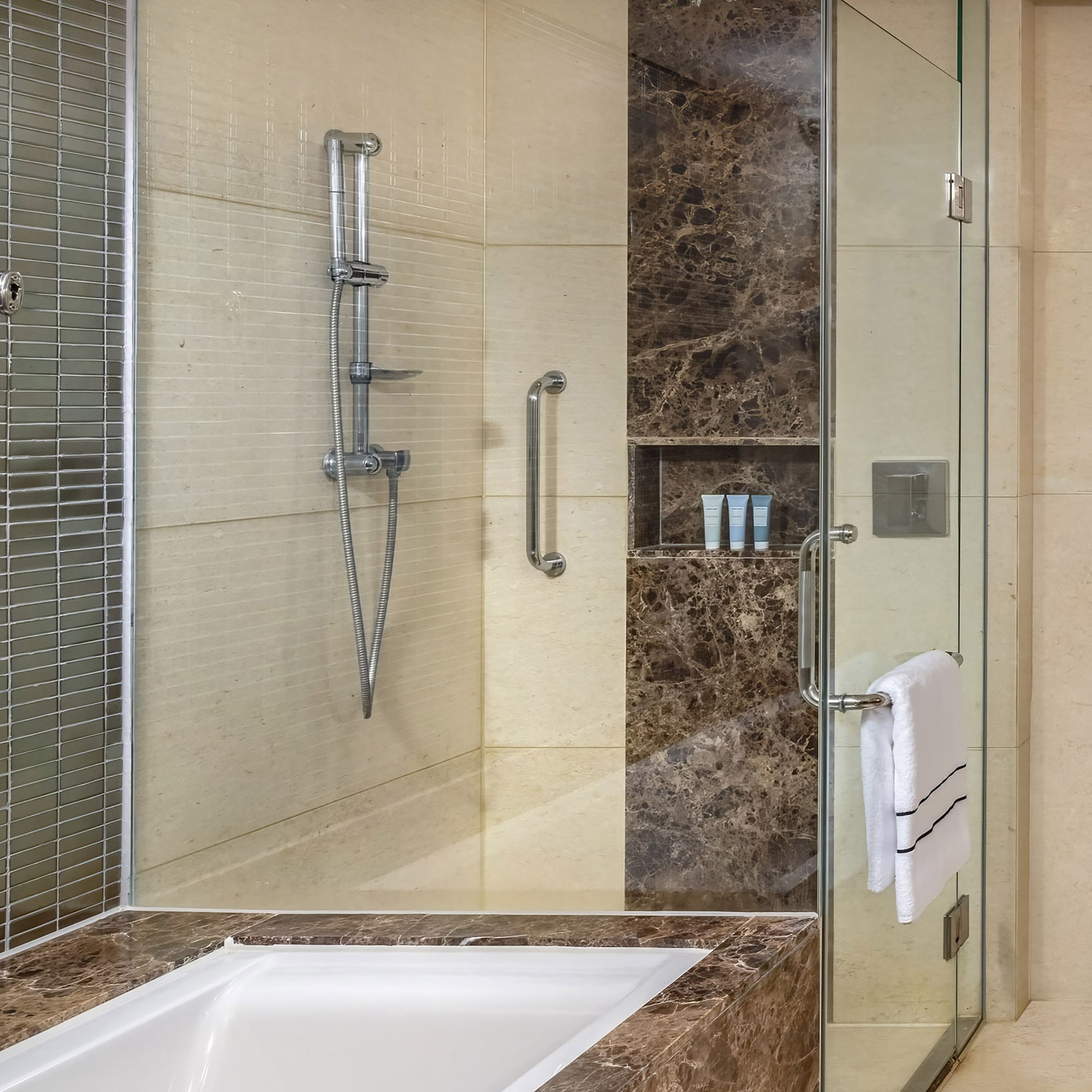 a bathroom with a bathtub and shower