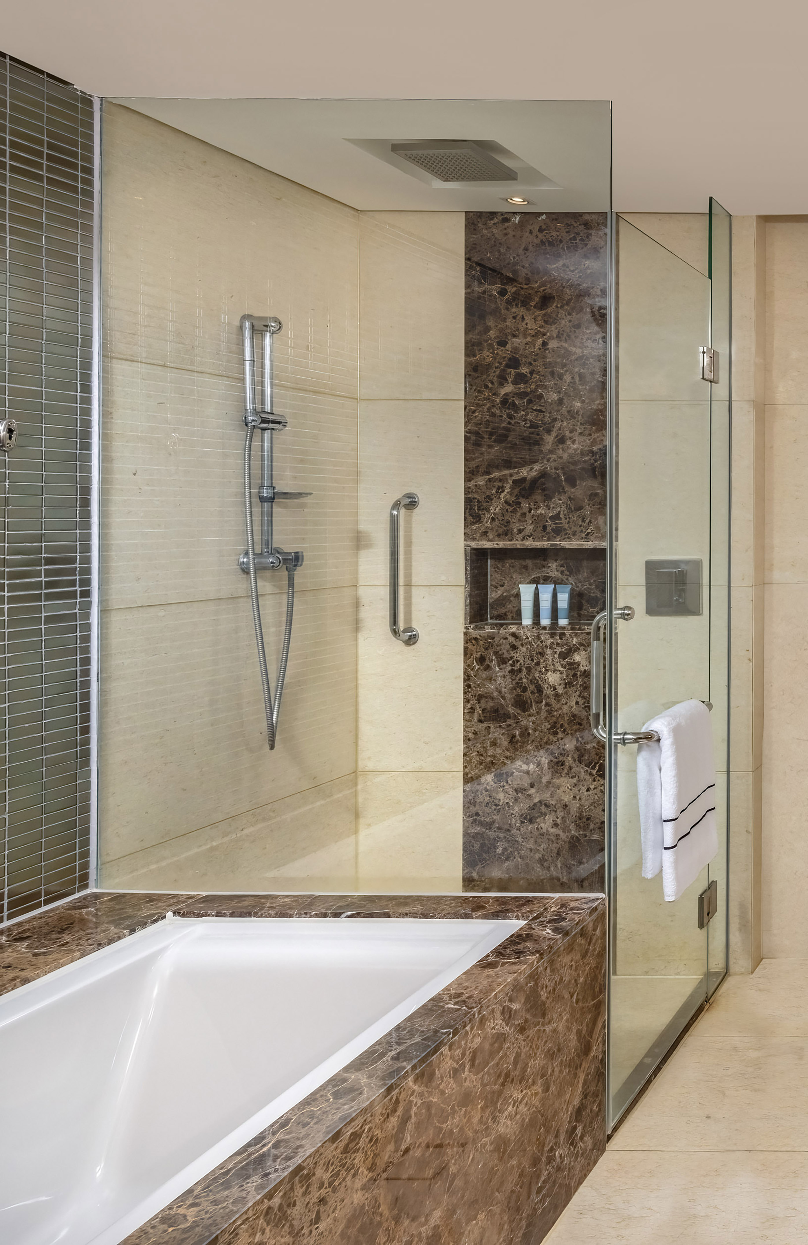 a bathroom with a bathtub and shower