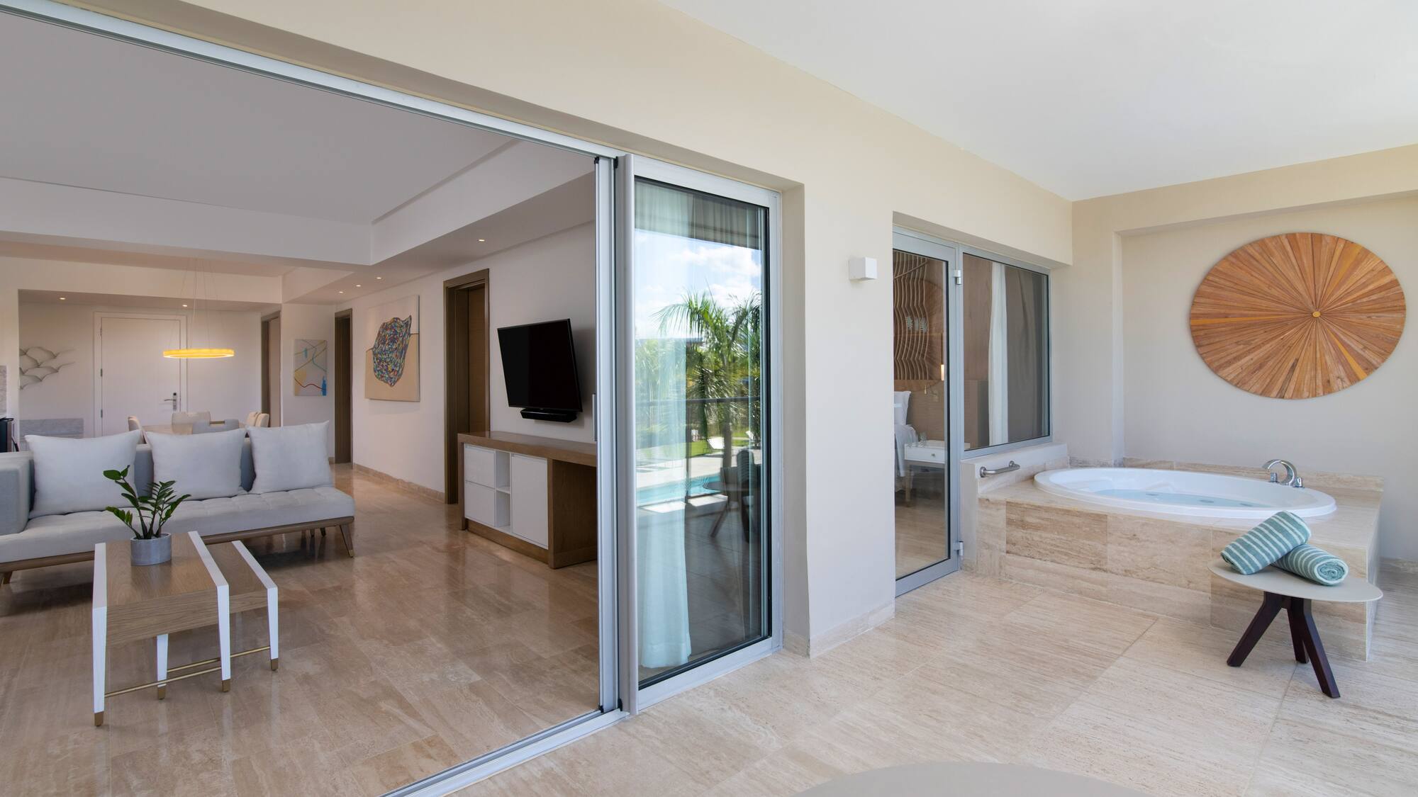 a room with a jacuzzi and a television