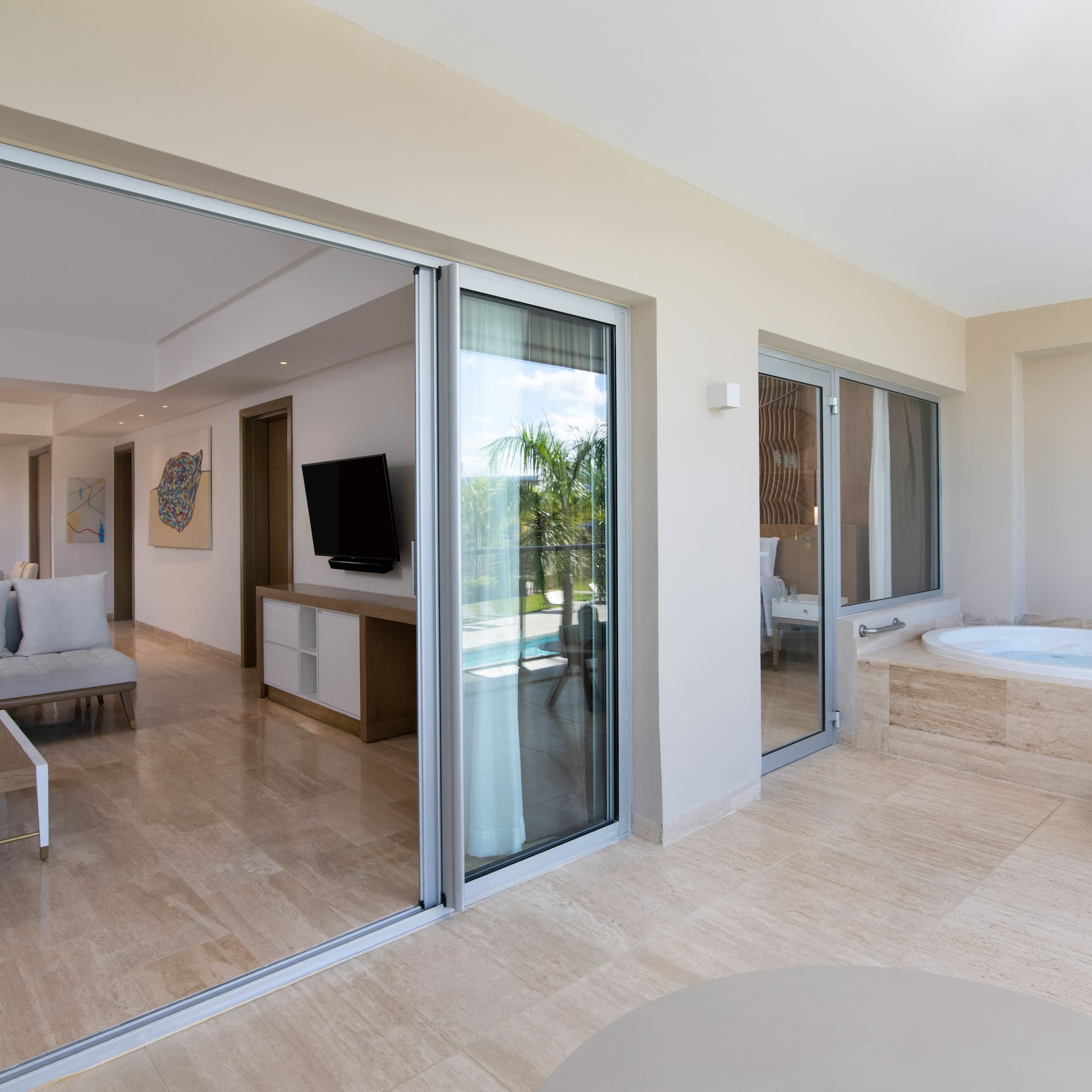 a room with a jacuzzi and a television