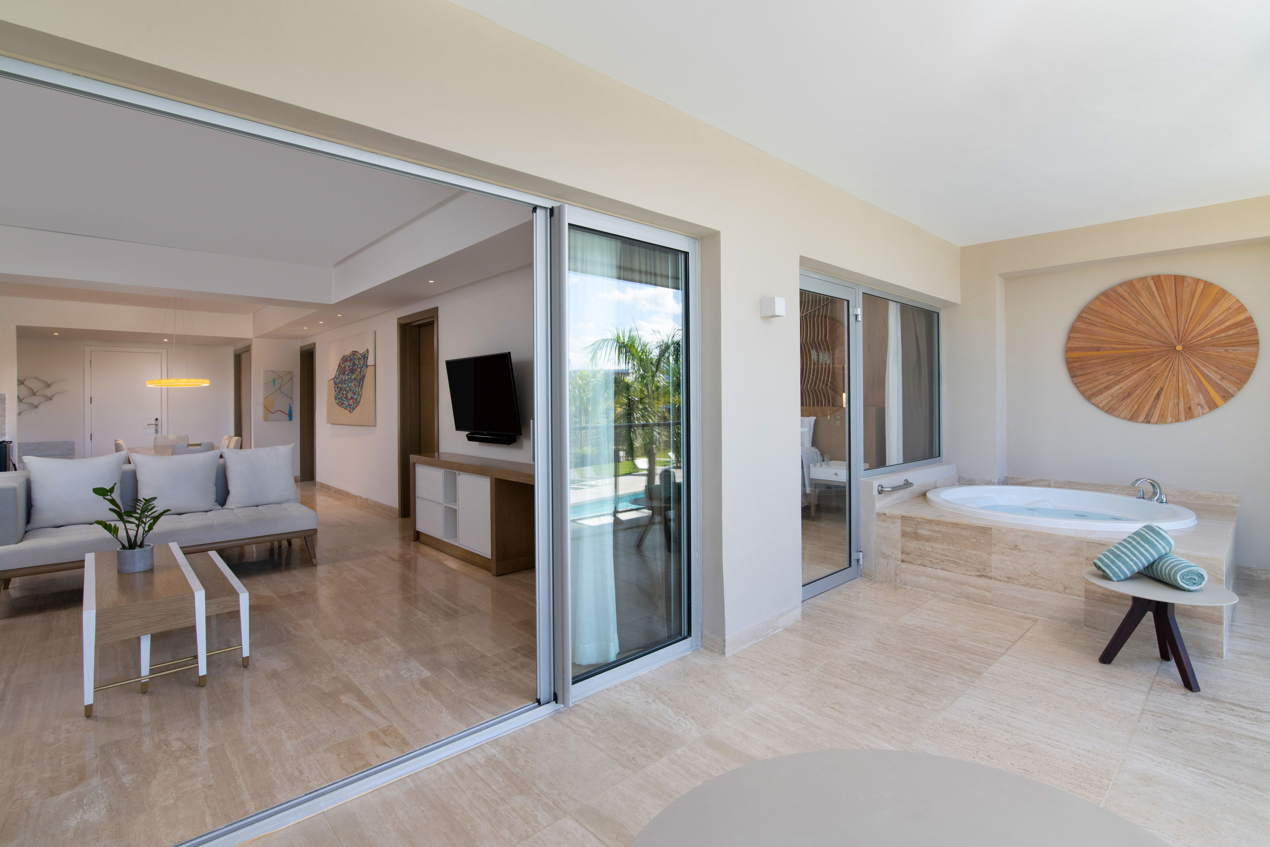 a room with a jacuzzi and a television