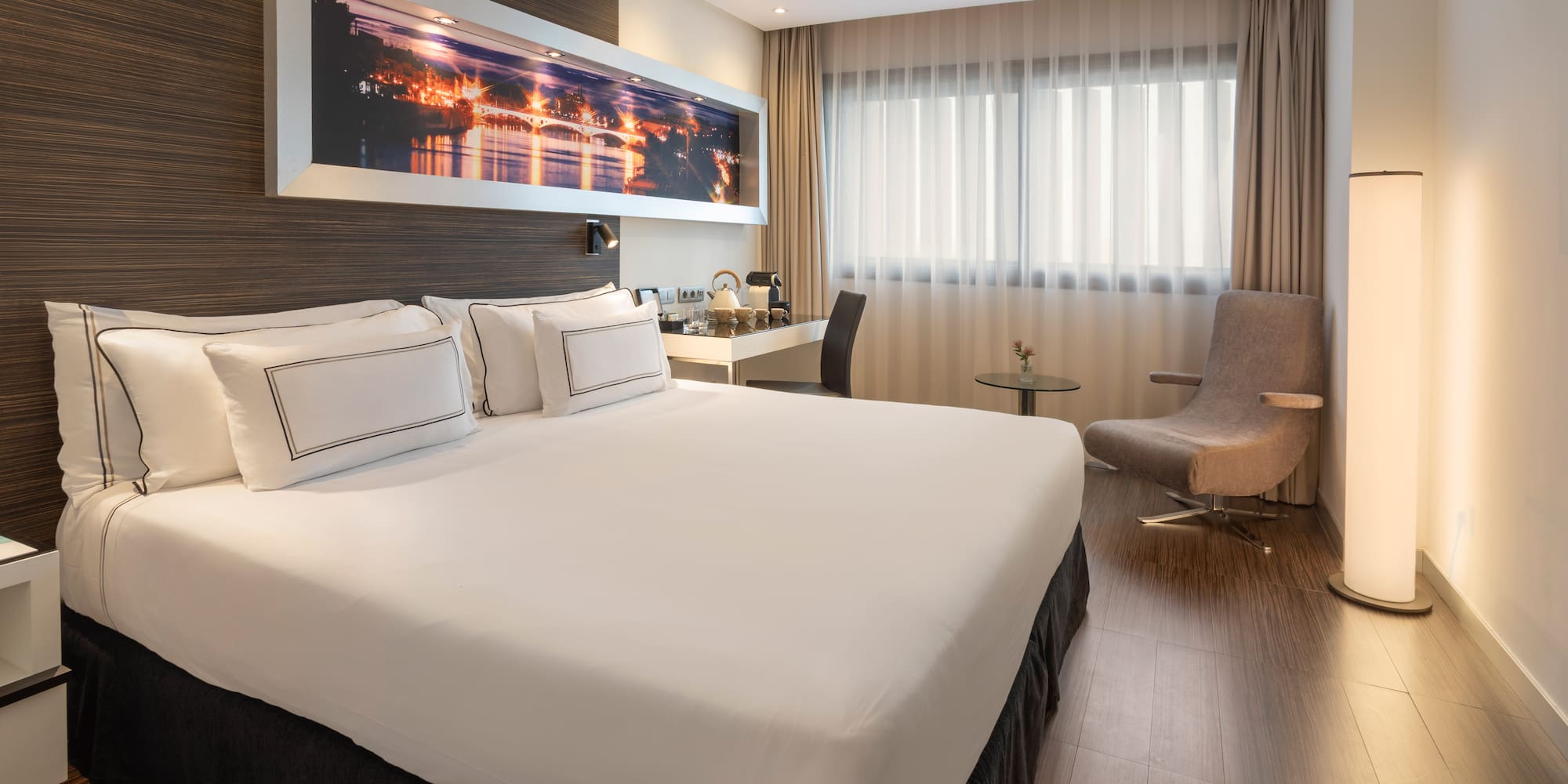 a room with a bed and a chair