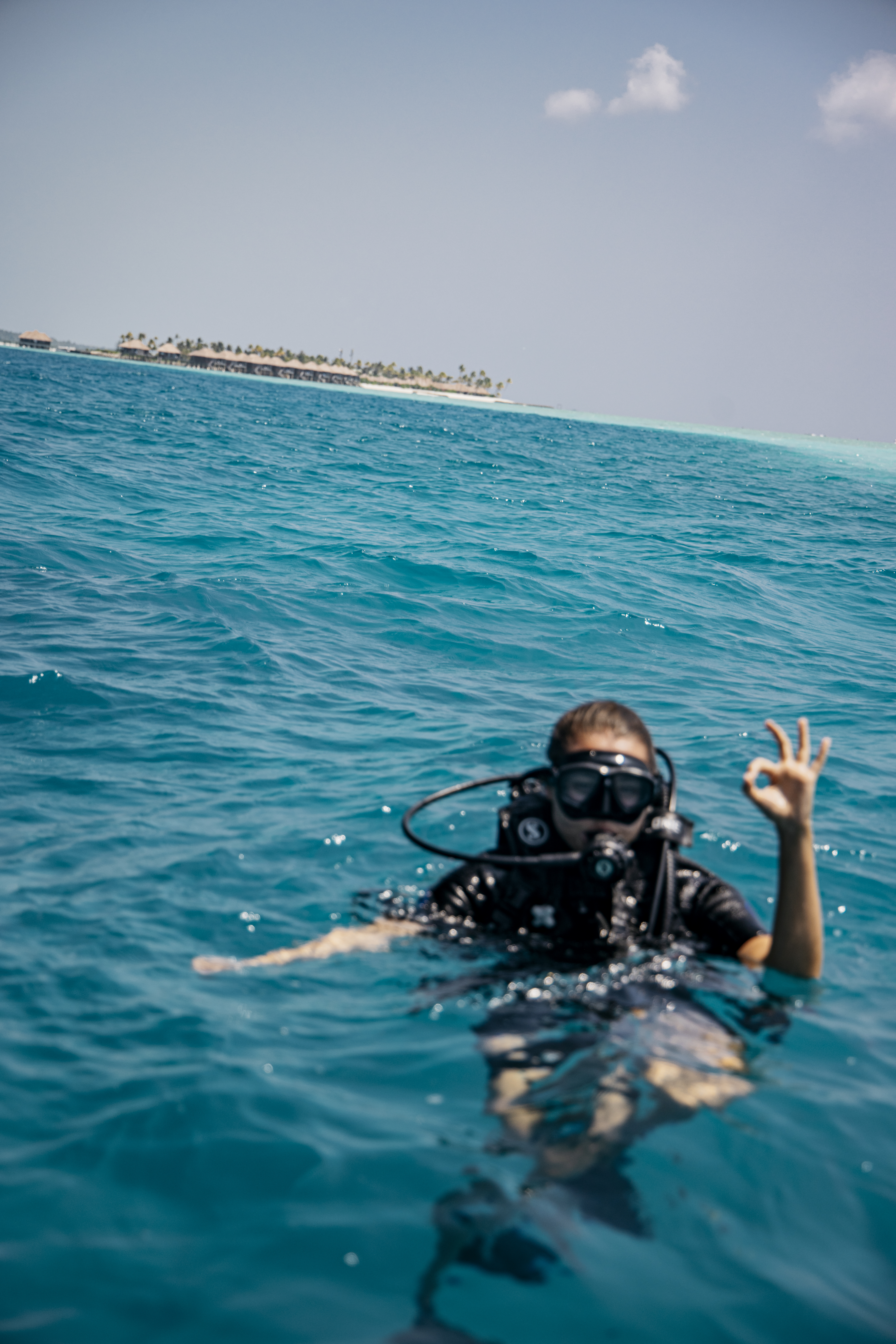 a person in a scuba suit in the ocean