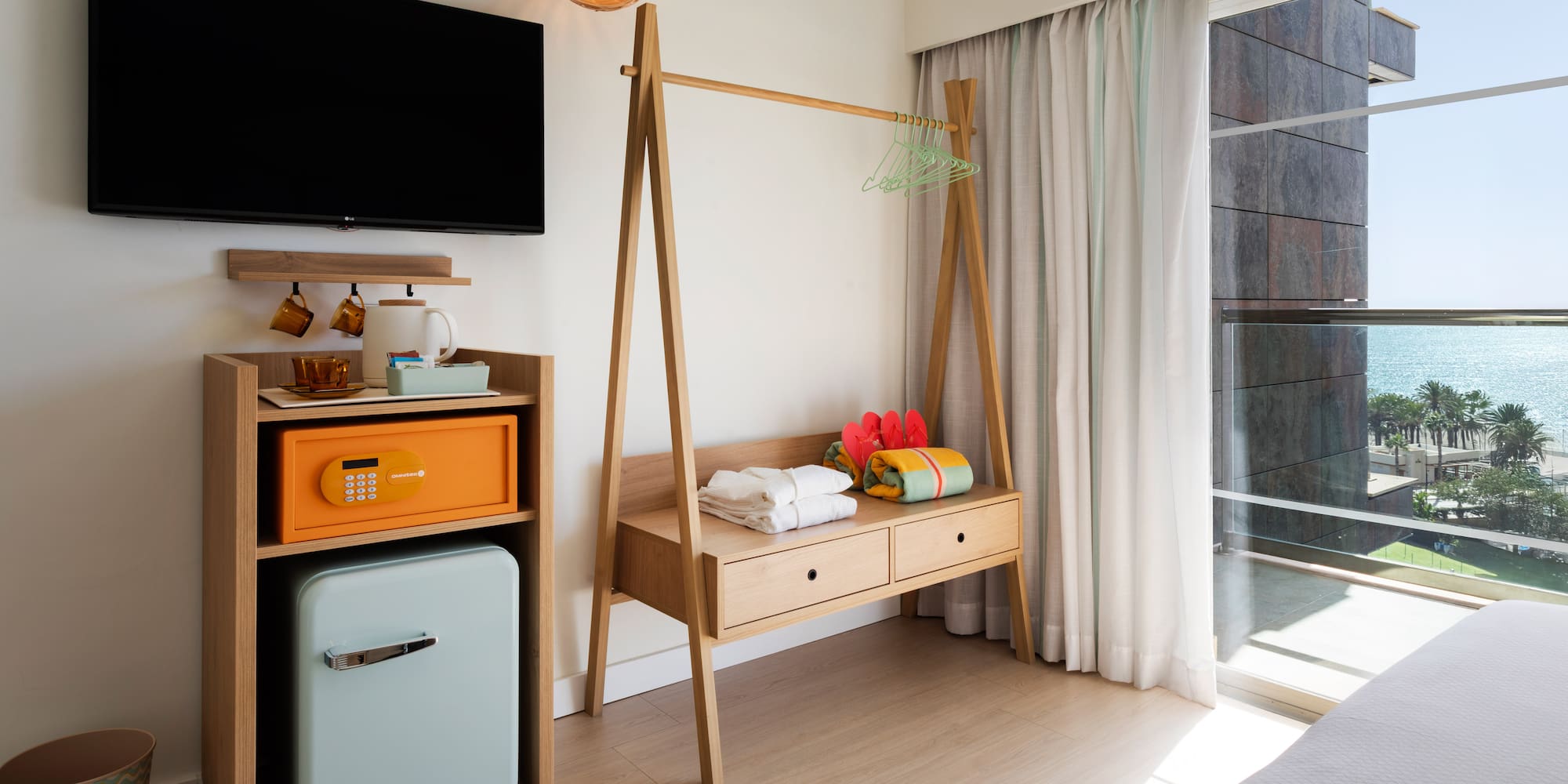 a room with a television and a shelf