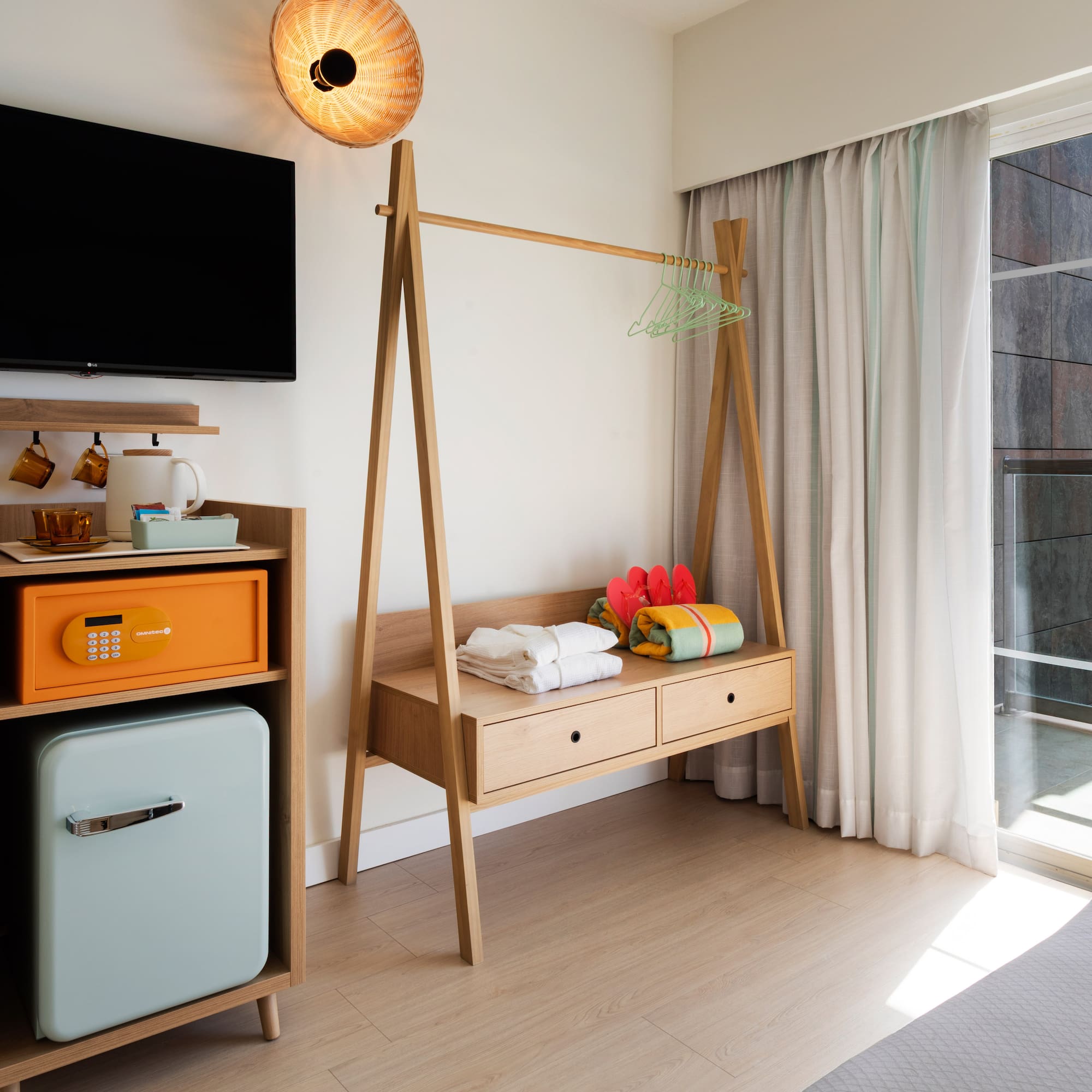 a room with a television and a shelf