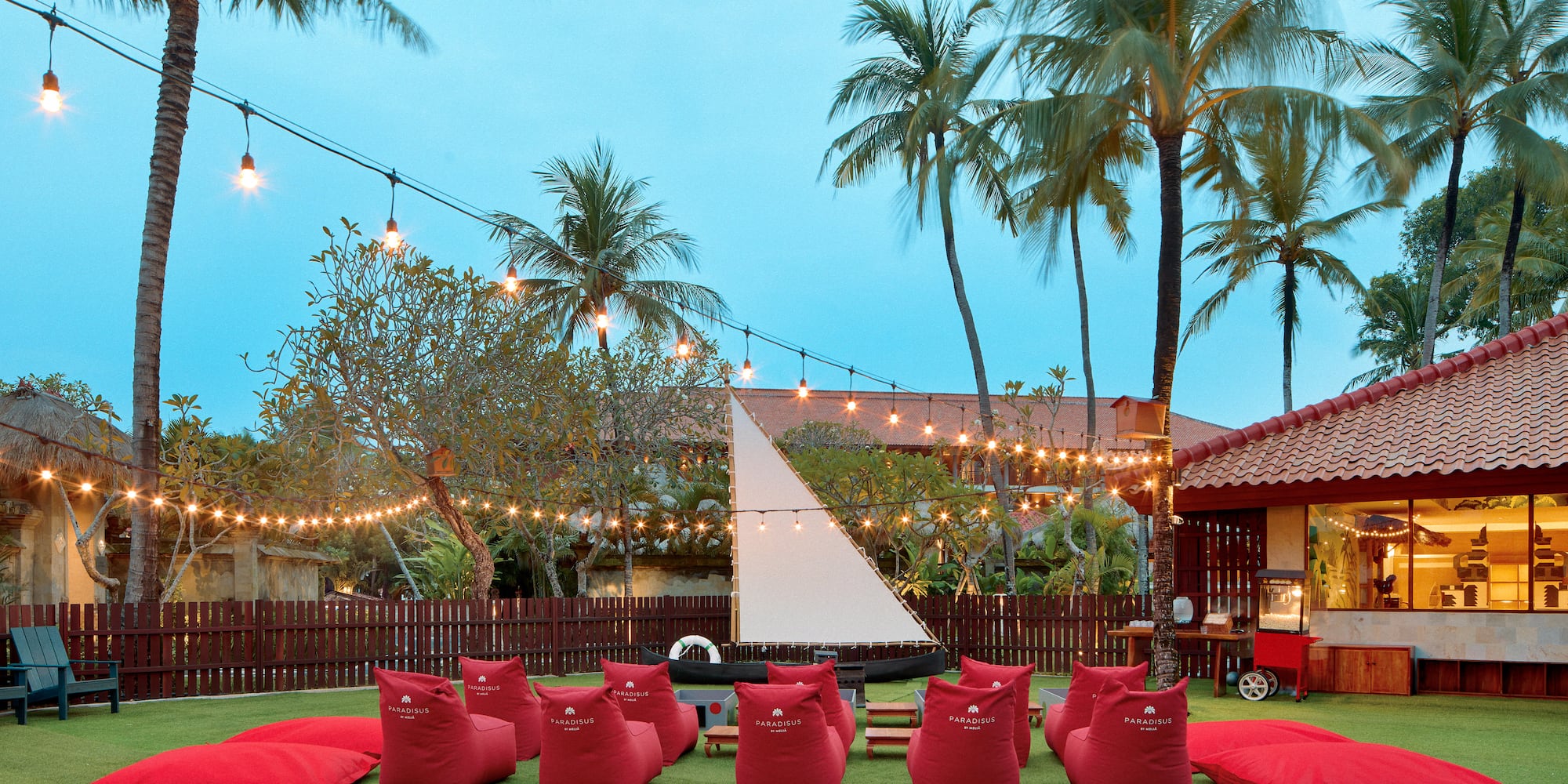 a group of red bean bags in a yard