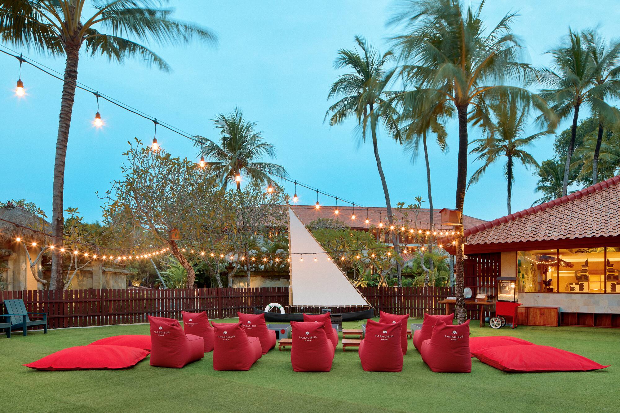 a group of red bean bags in a yard