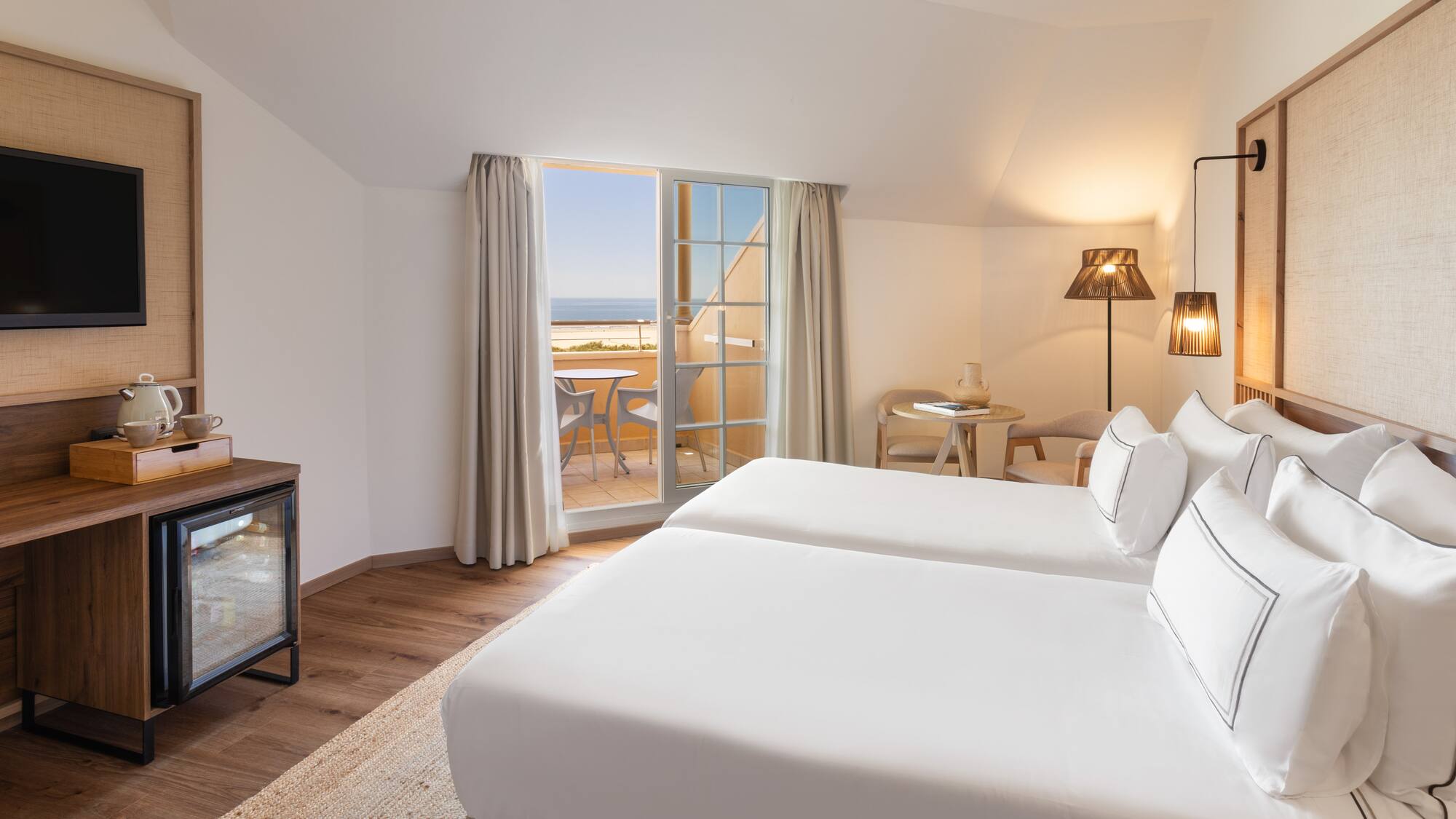 a room with two beds and a fireplace