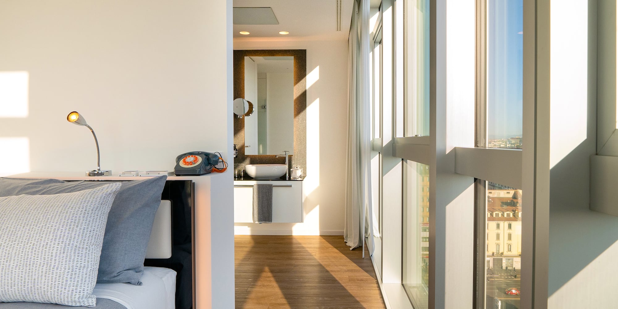 a room with a window and a wood floor